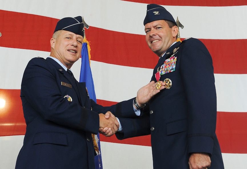 U.S. Air Force Maj. Gen. Lawrence Wells, 9th Air Force commander, presents the Legion of Merit to Col. Scott Kindsvater outgoing 93d Air Ground Operations Wing commander, at Moody Air Force Base, Ga., July 20, 2012. Kindsvater took command of the 93d AGOW in July of 2011. (U.S. Air Force photo by Staff Sgt. Ciara Wymbs/Released)