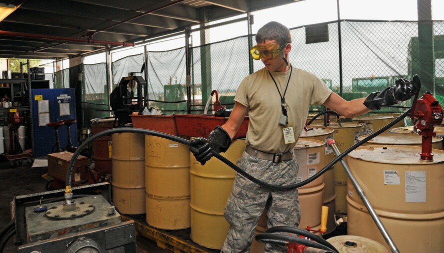 Airman 1st Class Broden McDonald, 2nd Aircraft Maintenance Squadron crew chief, fills a hydraulic servicing cart at the 96th Bomb Squadron's hazardous materials cage on Barksdale Air Force Base, La., July 23. The hazardous materials cage is part of the 96 BS support section. The section's responsible for keeping track of millions of dollars worth of tools and aircraft equipment, which are checked in and out during each work shift. (U.S. Air Force photo/Airman 1st Class Andrew Moua)(RELEASED)