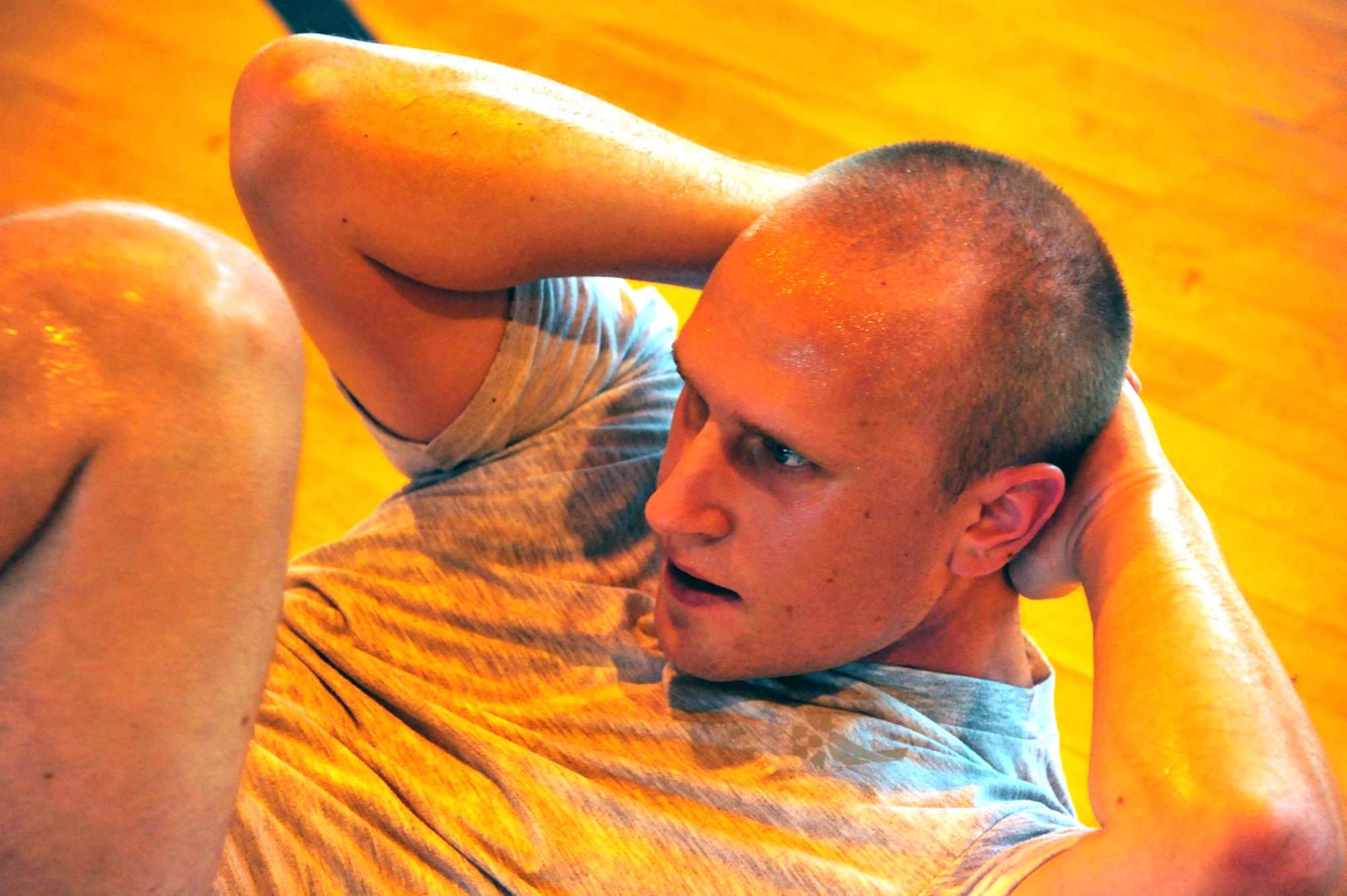 Airman 1st Class Timothy Reed, Air University A4/6 Logistics and Programming computer programmer finishes a set of crunches during physical training Wednesday at the Maxwell Gym Annex. (U.S. Air Force photo by Senior Airman Christopher Stoltz)
