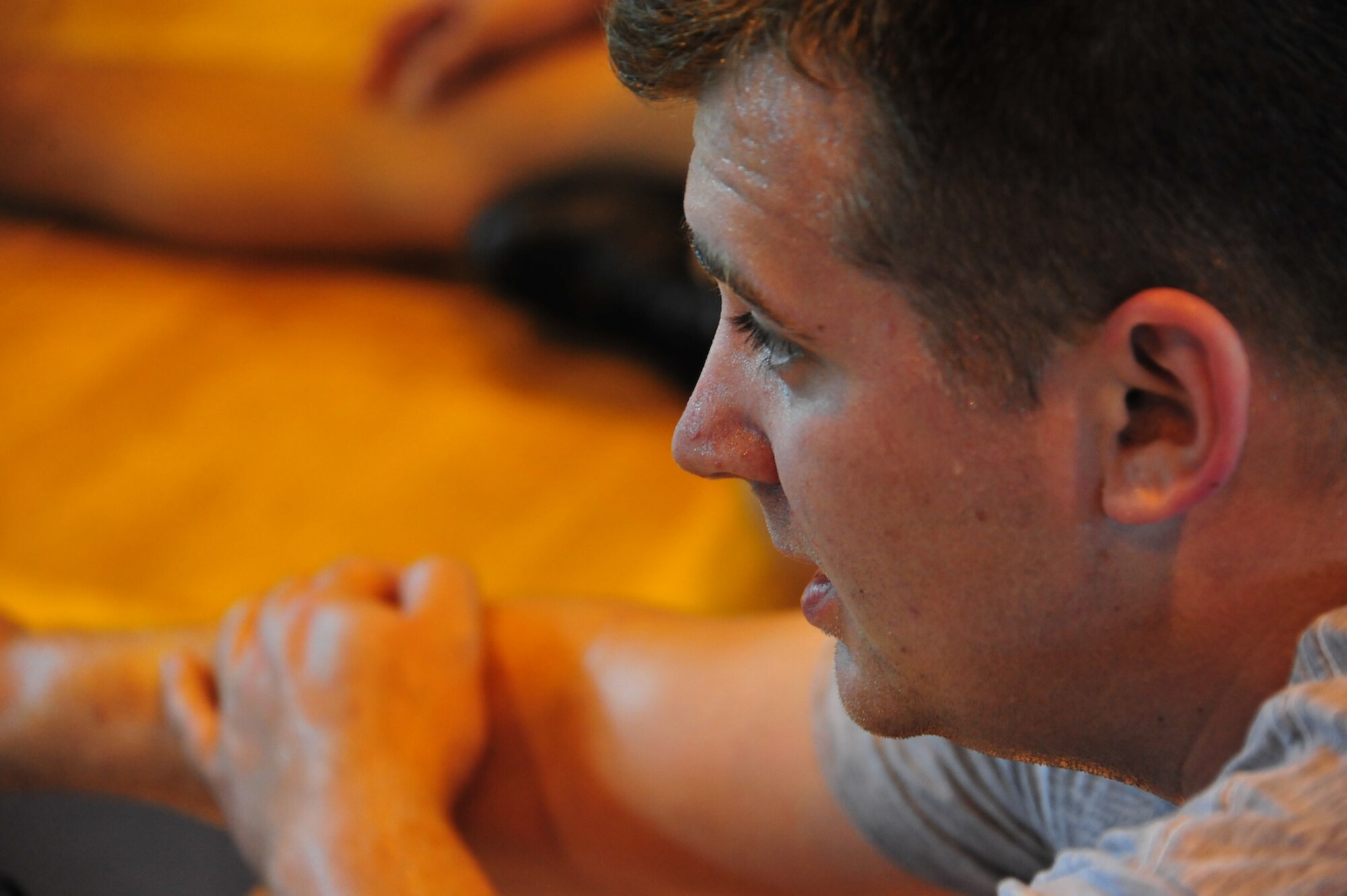 Senior Airman Brian Gardner, Air University A4/6 Logistics and Programming computer programmer stretches after completing circuit training with his unit Wednesday at the Maxwell Gym Annex. (U.S. Air Force photo by Senior Airman Christopher Stoltz)