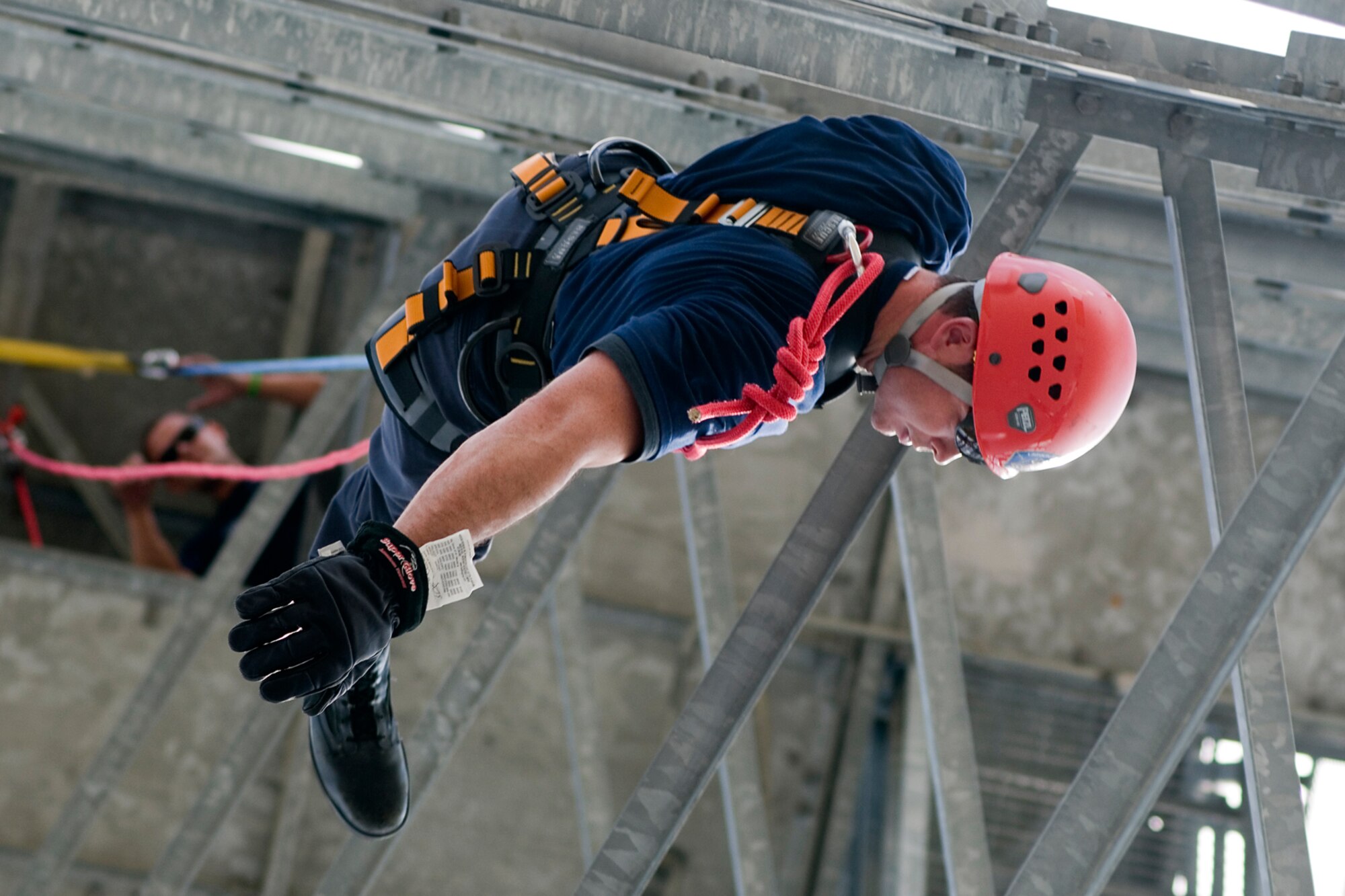 GRISSOM AIR RESERVE BASE, Ind. -- Robert Jacobs, Grissom firefighter, rappels down the base radar tower July 11. The Grissom Fire Department tested new harnesses used for rescue operations. (U.S. Air Force photo/Senior Airman Andrew McLaughlin)