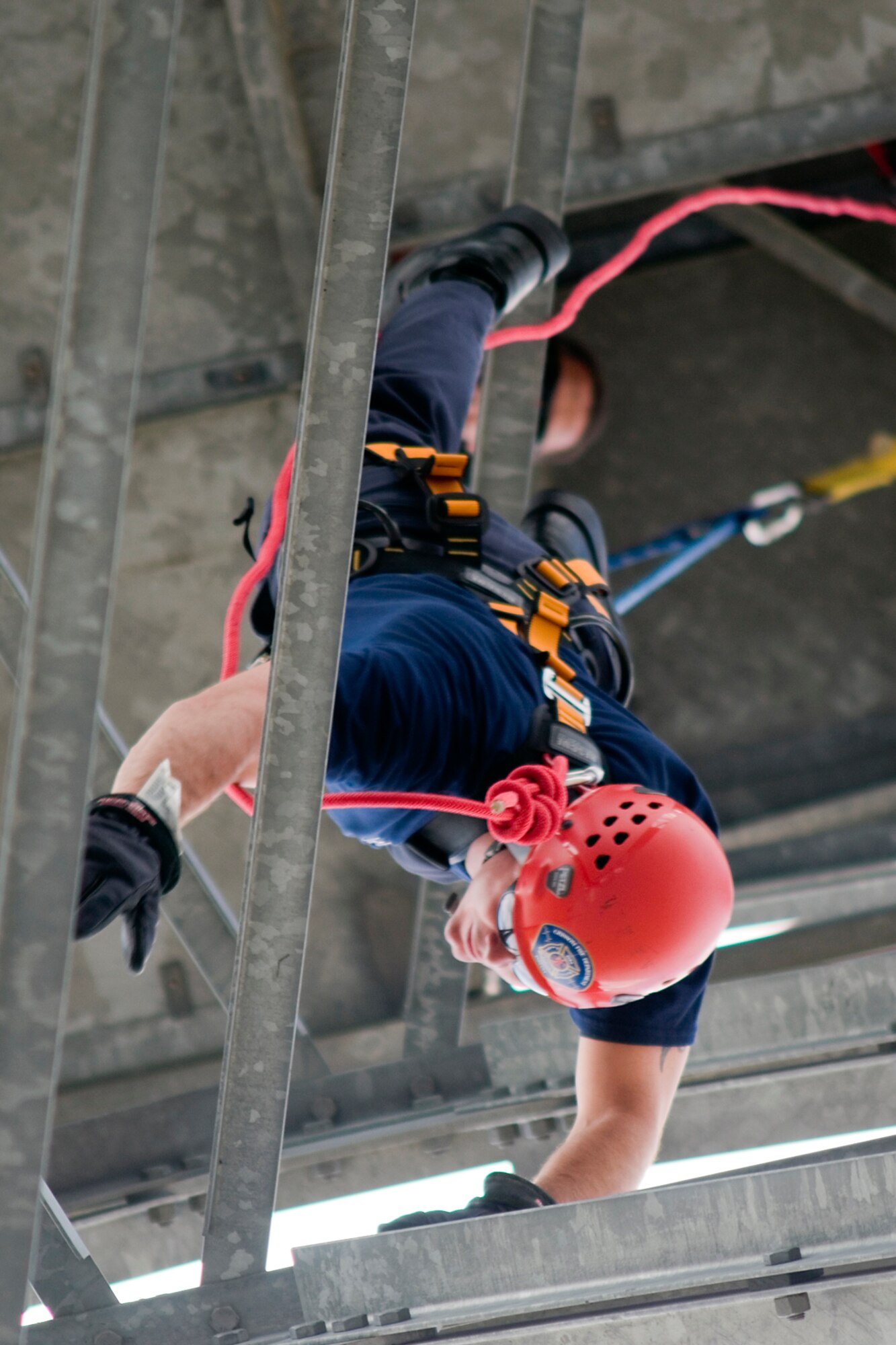 GRISSOM AIR RESERVE BASE, Ind. -- Robert Jacobs, Grissom firefighter, guides himself down the base radar tower as he rappels July 11. The Grissom Fire Department tested new harnesses used for rescue operations. (U.S. Air Force photo/Senior Airman Andrew McLaughlin)