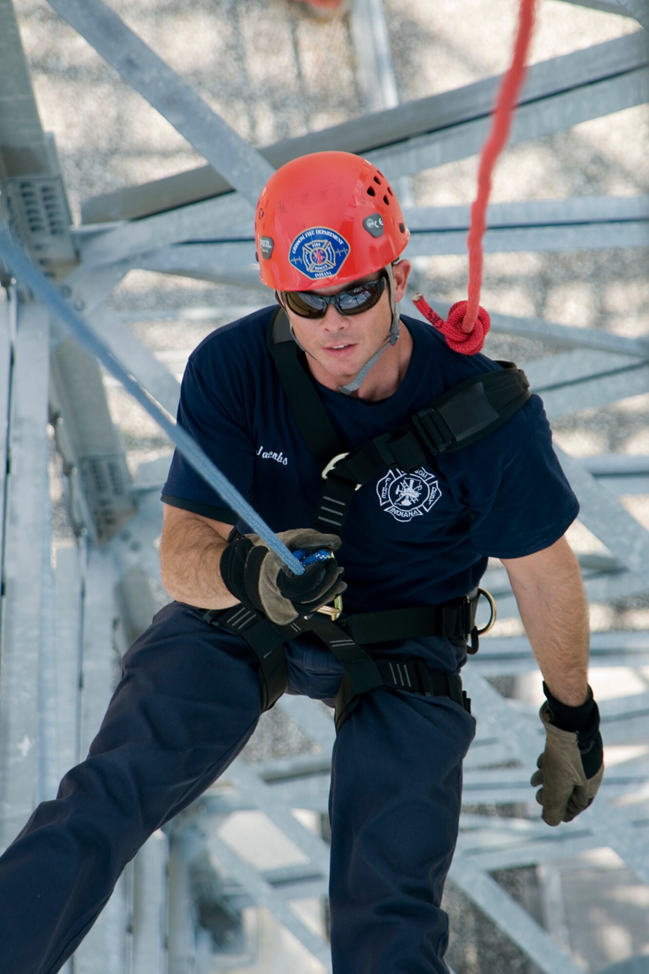 GRISSOM AIR RESERVE BASE, Ind. -- Robert Jacobs, Grissom firefighter, rappels down the base radar tower July 11. The Grissom Fire Department tested new harnesses used for rescue operations. (U.S. Air Force photo/Senior Airman Andrew McLaughlin)