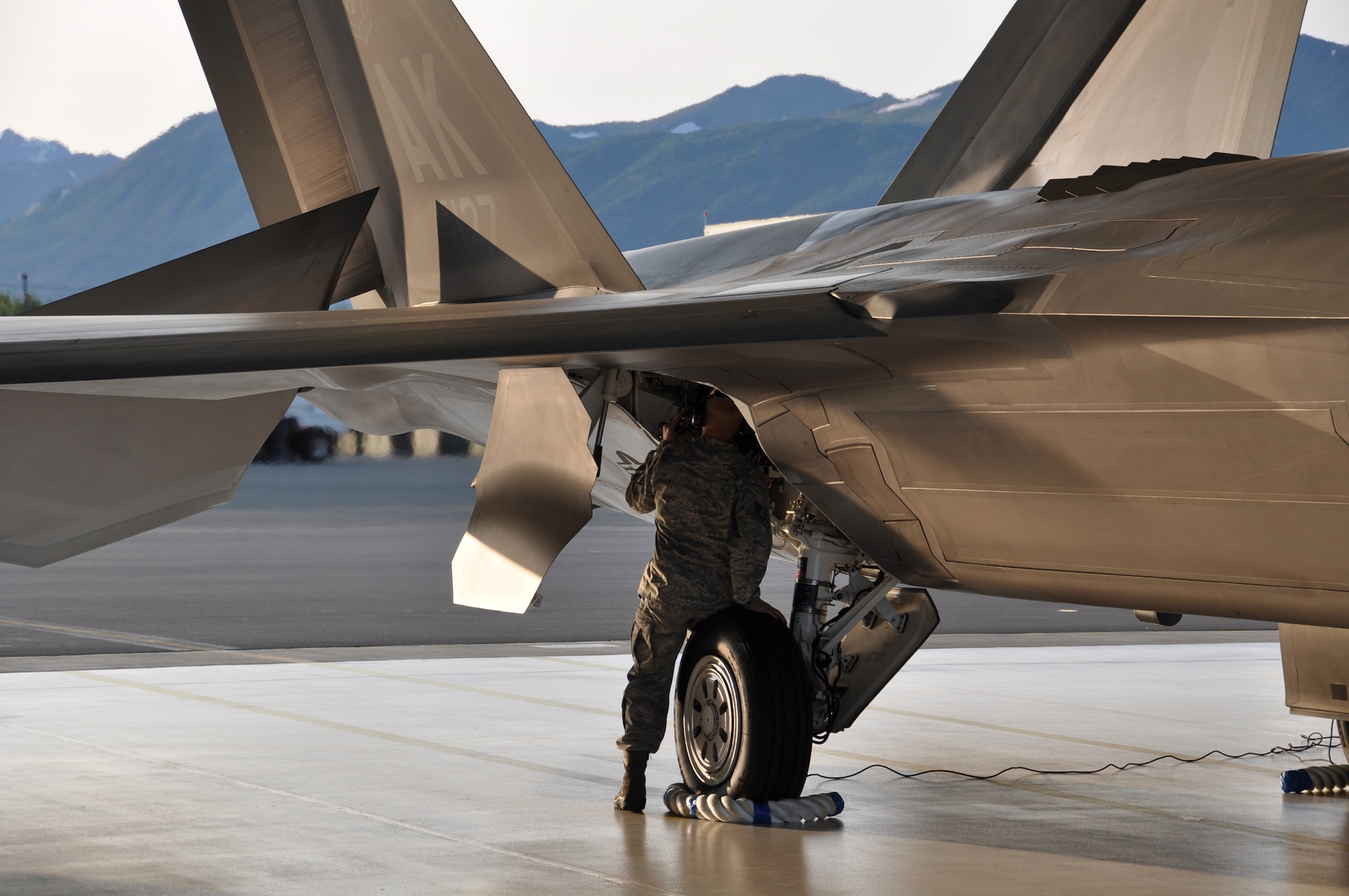Staff Sgt. Justin Klein, an F-22 crew chief and Reservist assigned to the 477th AMXS, inspects the aircrafts hydraulic system during the aircraft launch for the 3rd Wings Turkey Shoot July 19. Aircraft Maintainers were evaluated on their ability to produce combat ready aircraft. (U.S. Air Force Photo/Tech. Sgt. Dana Rosso) 