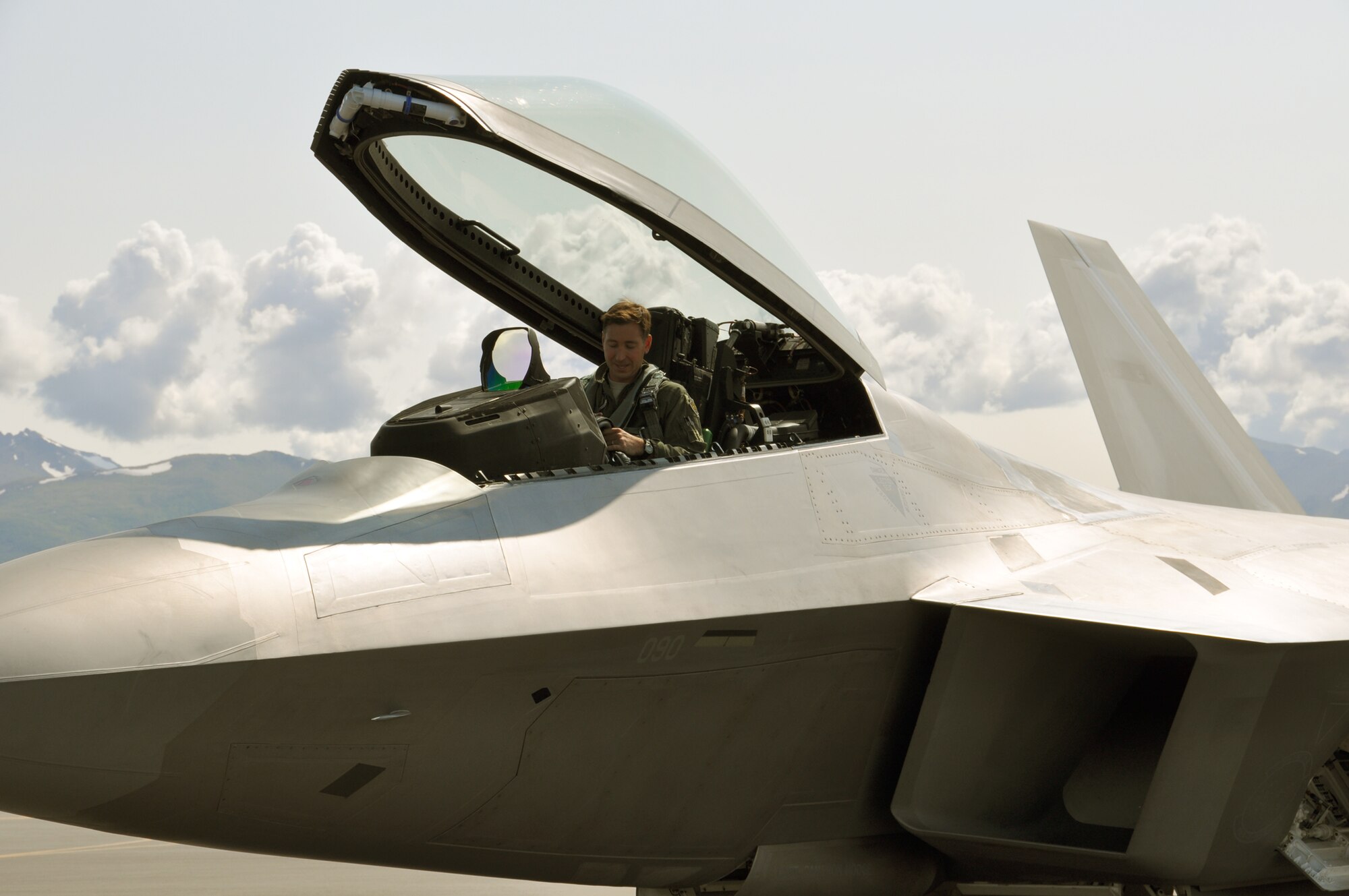 Lt. Col. Chad Feucht, a Reserve F-22 pilot assigned to the 477th Fighter Group conducts final checks on his flight equipment July 18. Feucht is part of the first Reserve four ship taking part in the 3rd Wings Turkey Shoot here. (U.S. Air Force Photo/Tech. Sgt. Dana Rosso)
