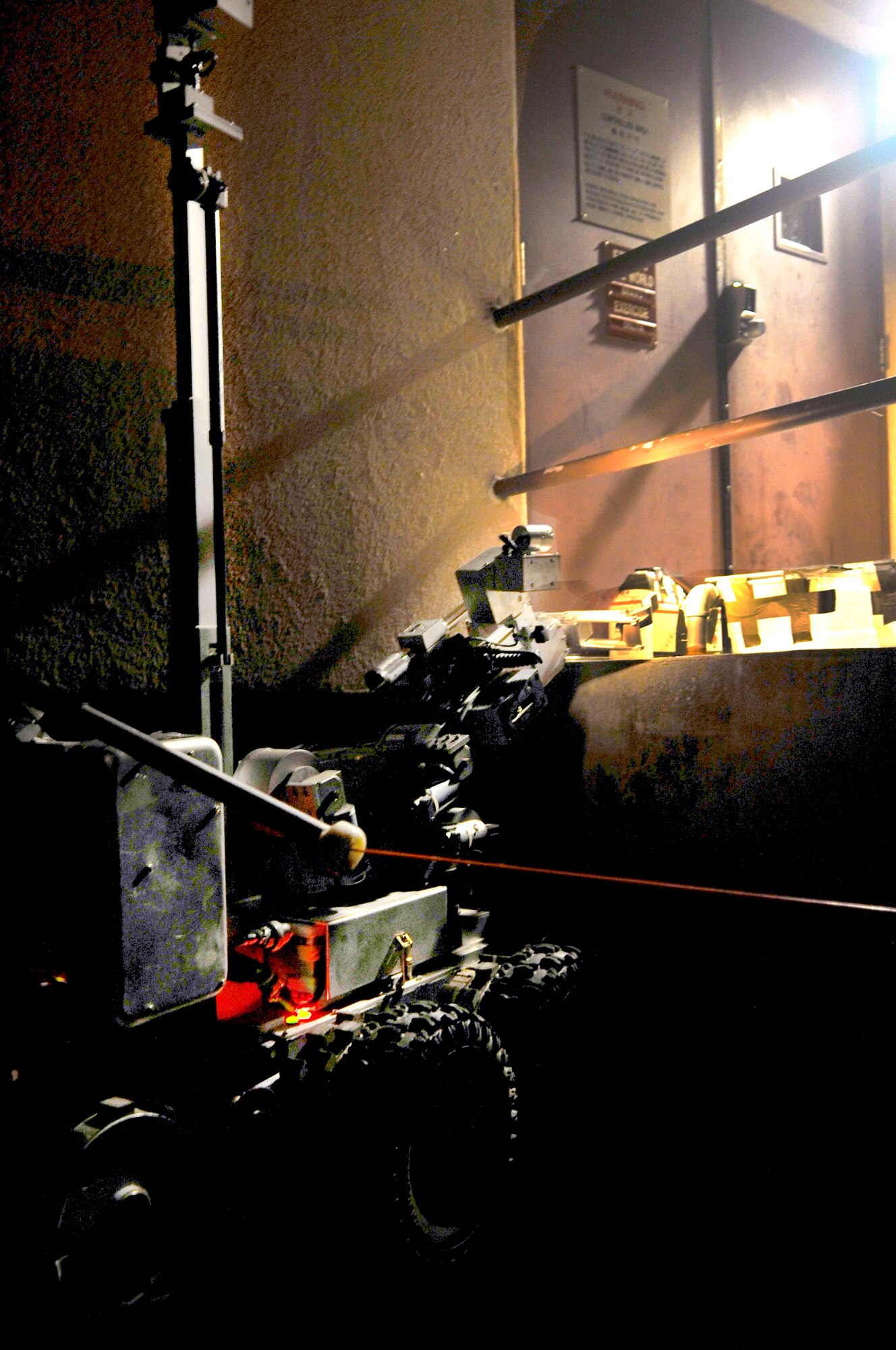 An F6 robot, used by the 51st Civil Engineer Squadron Explosive Ordinance Disposal flight, prepares to look over a suspicious package from the radar approach control building during a base-wide exercise here, July 23, 2012. F6 is equipped with several television cameras for remote viewing and a dexterous arm for hazardous tasks.  Osan Airmen are participating in Beverly Midnight 12-03, the third readiness exercise in 2012 here. (U.S. Air Force photo/Staff Sgt. Stefanie Torres)