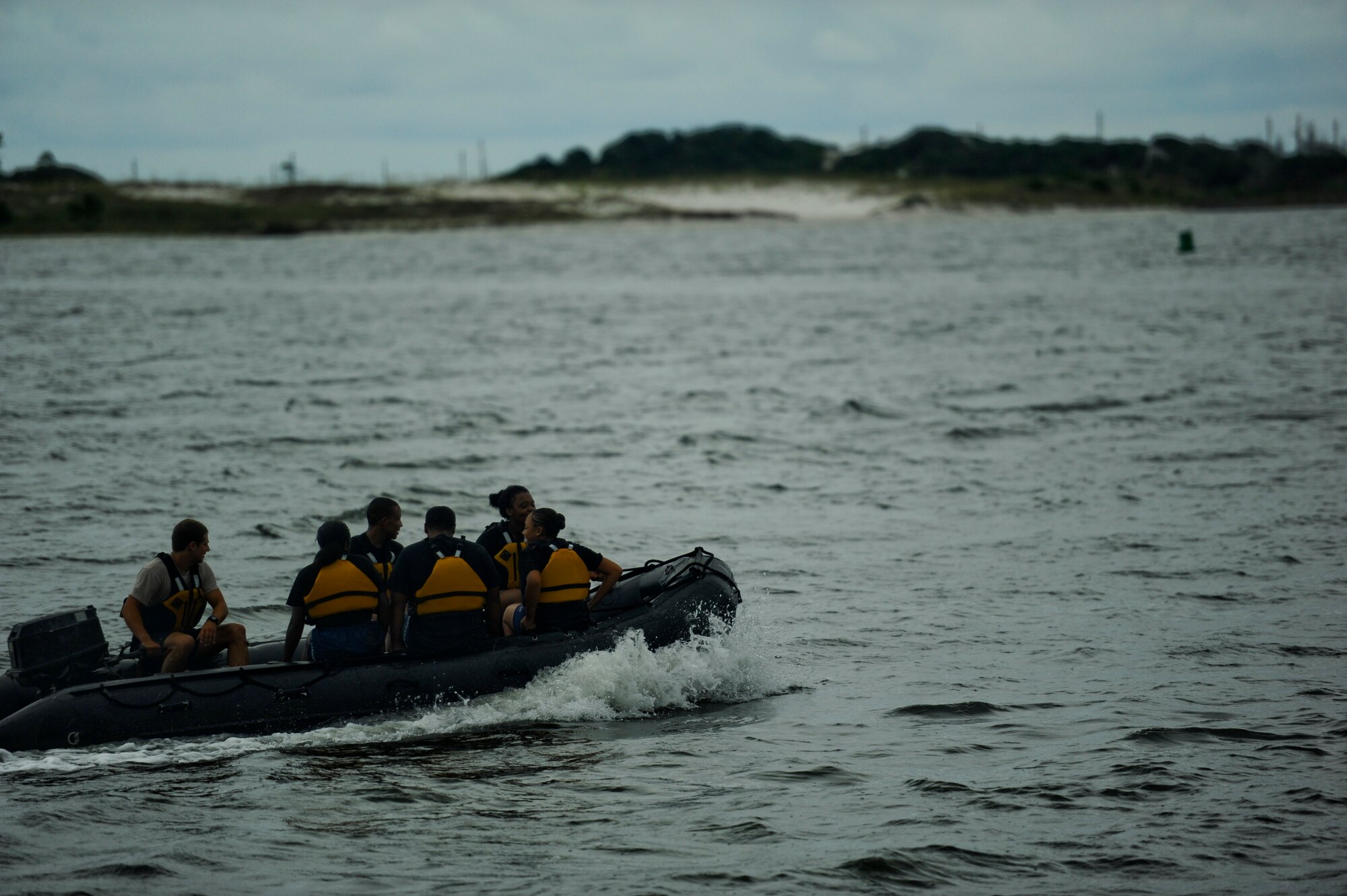 A student from the Special Tactics Training Squadron drives the boat for cadets from the Pensacola Air Force Junior ROTC, July 19, 2012 at the marina on Hurlburt Field, Fla. From July 16-20, more than 40 cadets from Pensacola Air Force Junior ROTC visited base for their Summer Leadership School -- a course designed to teach cadets leadership, confidence and other traits. (U.S. Air Force photo by Staff Sgt. David Salanitri/ Released)