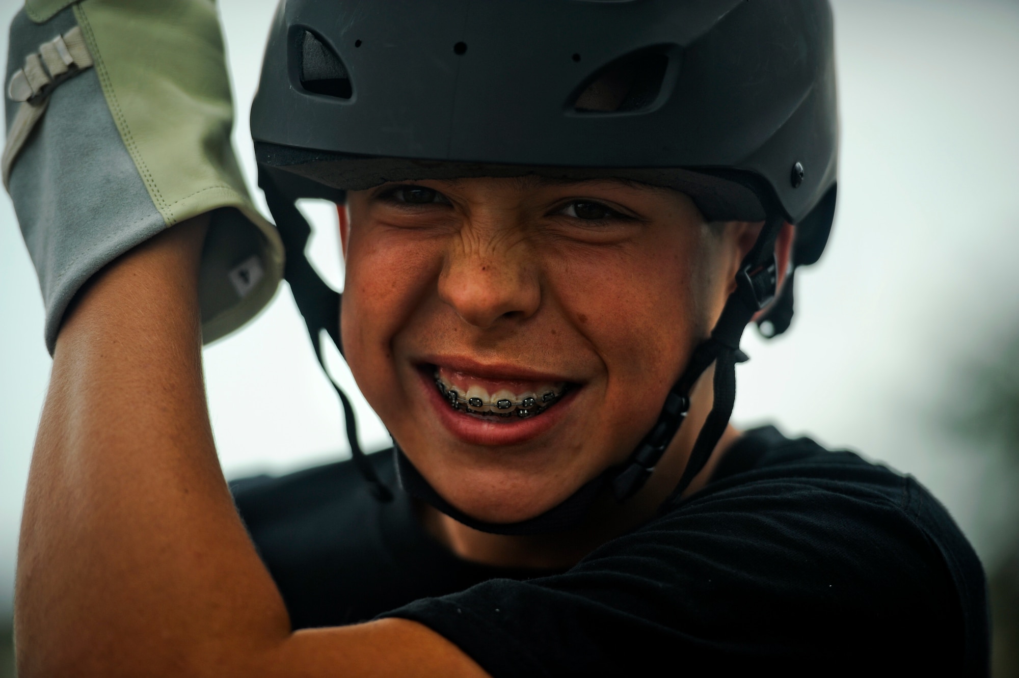 Pensacola Air Force Junior ROTC cadet Thomas Olney smiles before rappelling down a tower, July 18, 2012 at Hurlburt Field, Fla. The tower is typically used to train Air Force Special Tactics Airmen. (U.S. Air Force photo by Staff Sgt. David Salanitri/ Released)