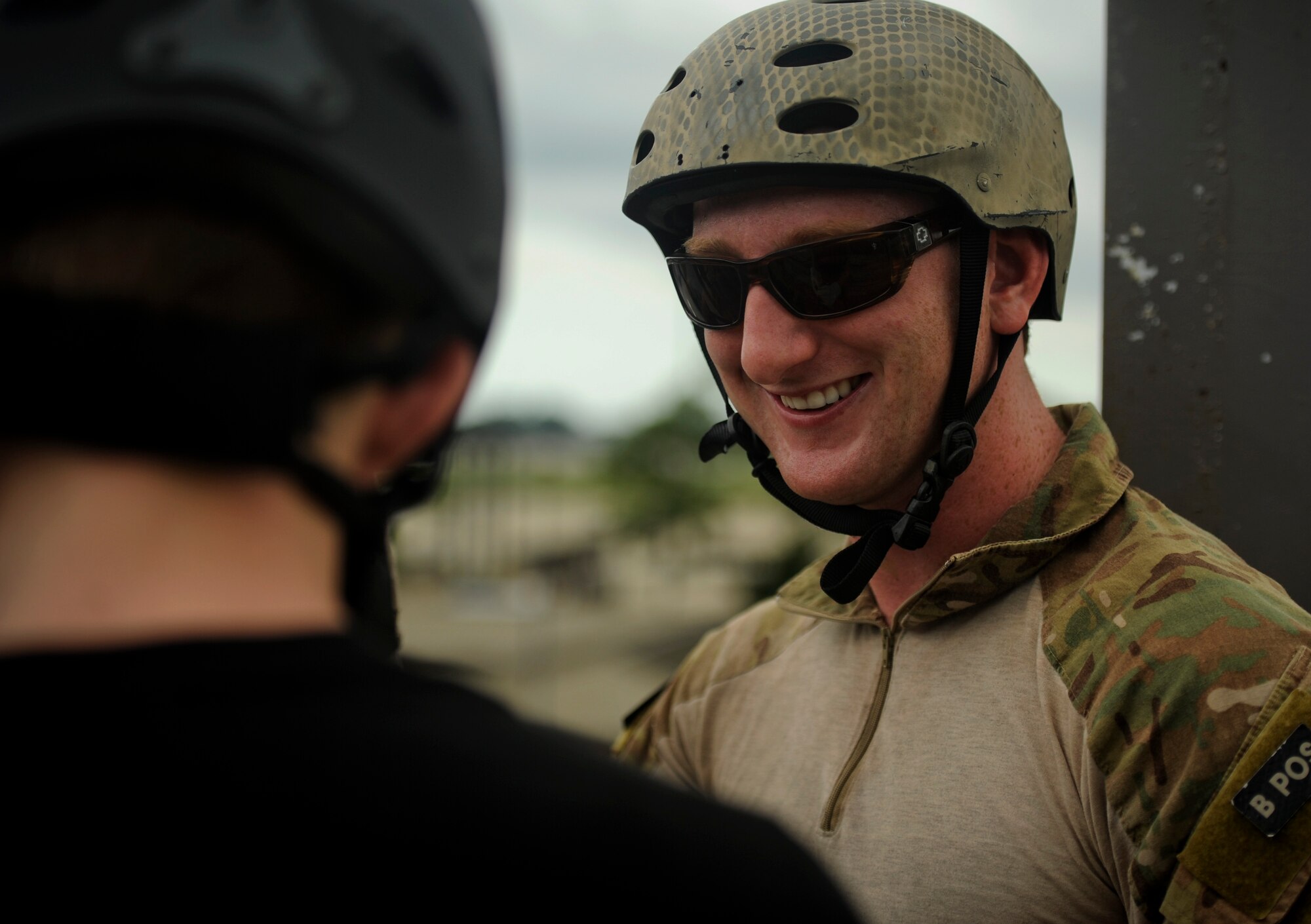 U.S. Air Force Senior Airman Philip Armstrong, a pararescueman with the 23rd Special Tactics Squadron, eases a cadets fears before rappelling down a tower, July 18, 2012, at Hurlburt Field, Fla. From July 16-20, more than 40 cadets from Pensacola Air Force Junior ROTC visited base for their Summer Leadership School -- a course designed to teach cadets leadership, confidence and other traits. (U.S. Air Force photo by Staff Sgt. David Salanitri/ Released)