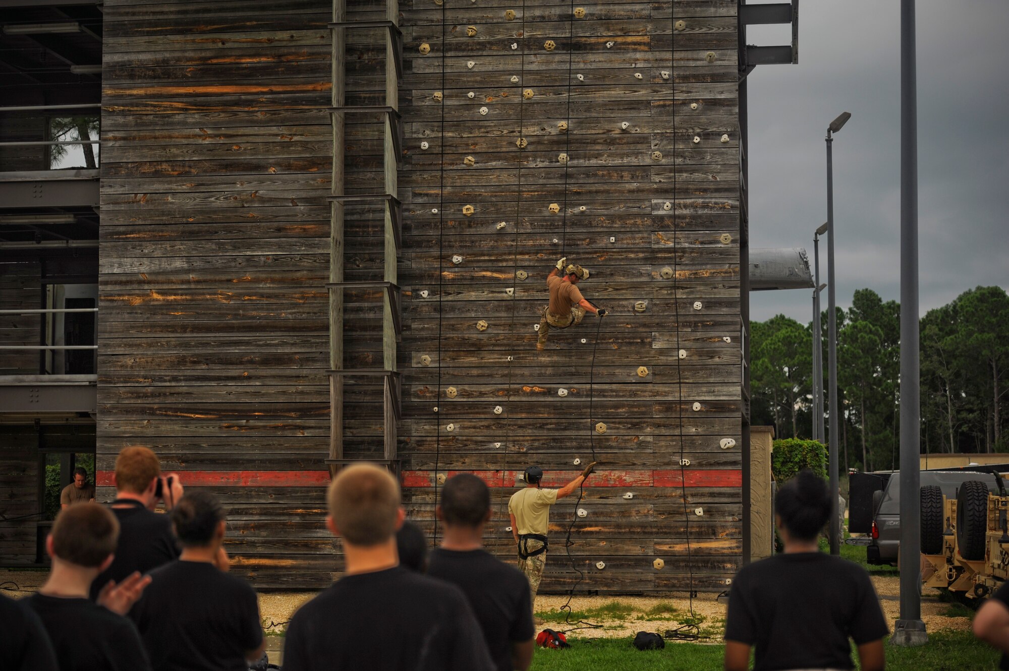 A member from the 23rd Special Tactics Squadron rappels down a tower July 18, 2012, at Hurlburt Field, Fla. Members from the Pensacola Air Force Junior ROTC would defeat their fear, and rebel down the tower.(U.S. Air Force photo by Staff Sgt. David Salanitri/ Released)