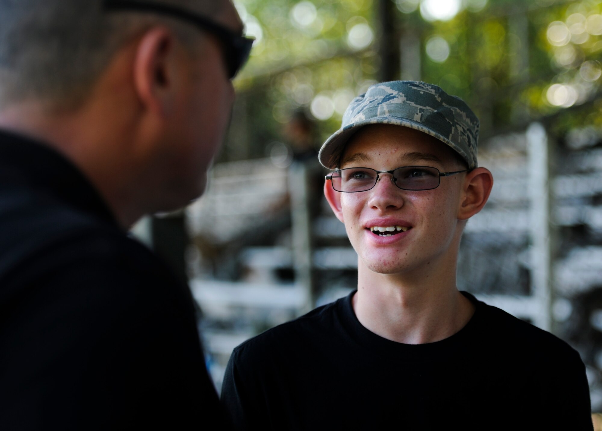 Pensacola Air Force Junior ROTC cadet Levi Crowley talks to an instructor July 17, 2012, at Hurlburt Field, Fla. From July 16-20, more than 40 cadets from Pensacola Air Force Junior ROTC visited base for their Summer Leadership School -- a course designed to teach cadets leadership, confidence and other traits.(U.S. Air Force photo by Staff Sgt. David Salanitri/ Released)