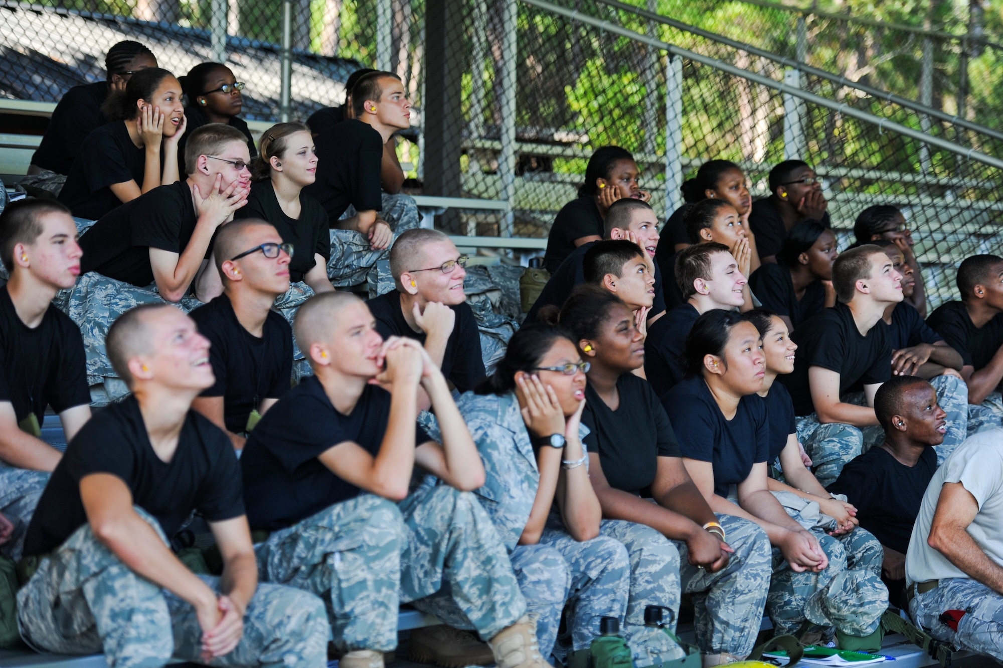 Cadets from the Pensacola Air Force Junior ROTC react to an explosion on the firing range, July 17, 2012 at Hurlburt Field, Fla. The cadets were observing a class on dynamics in terrorism. (U.S. Air Force photo by Staff Sgt. David Salanitri/ Released)