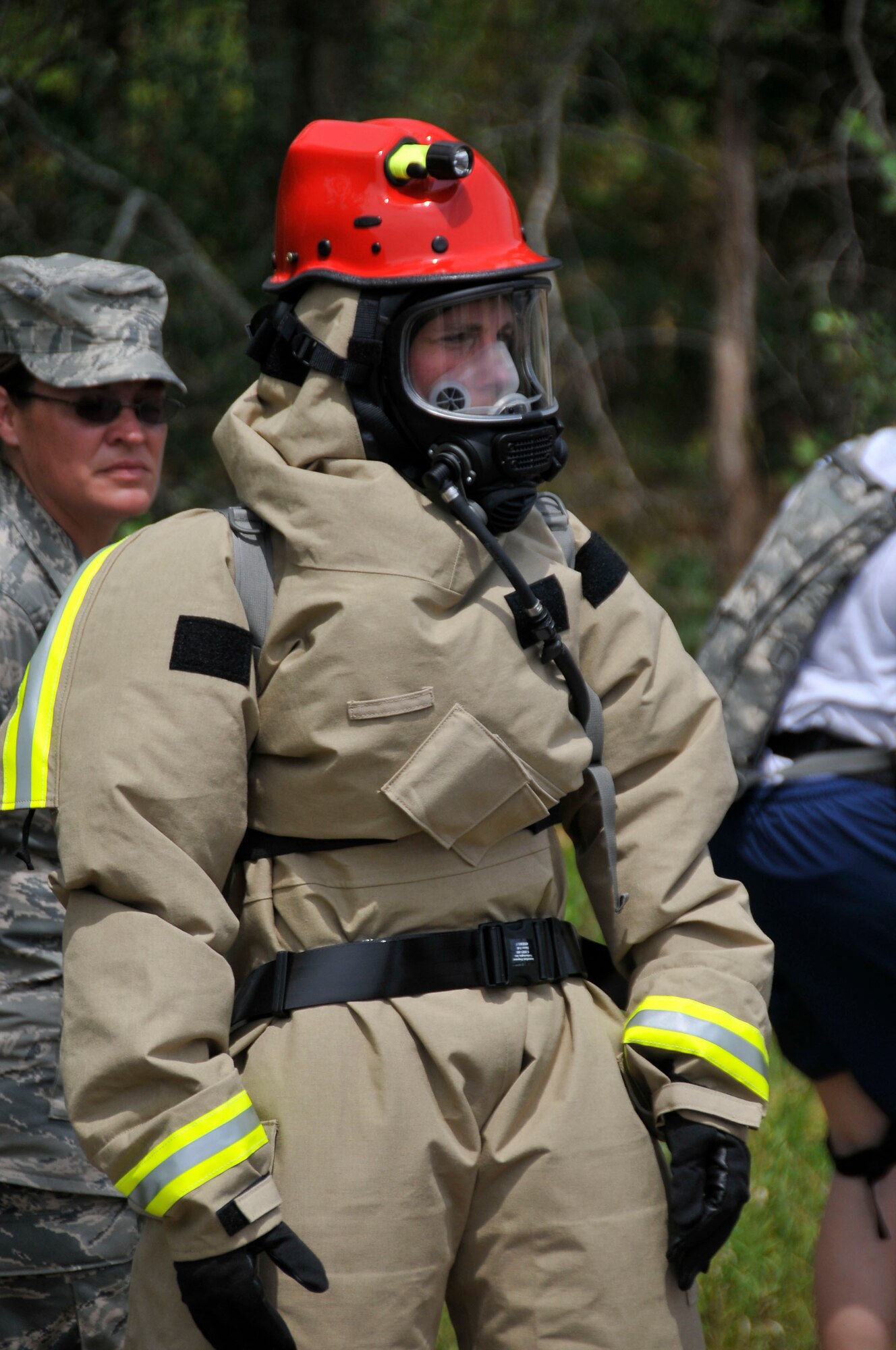 Tech. Sgt. Angela Shaw, 181st Intelligence Wing/Force Support Squadron, suits up to recover and extract the dead during Patriot 2012 at Volk Field, Wis., July 18, 2012. (U.S. Air Force photo by Master Sgt. John Day/Released)