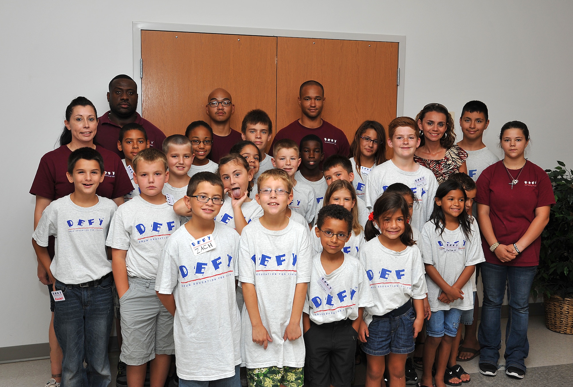 GOODFELLOW AIR FORCE BASE, Texas-- The children of the Drug Education for Youth Camp pose for a photo with their mentors July 17. The DEFY camp helps teach children the potential dangers of drugs and ways they can affect your life. (U.S. Air Force photo/Airman 1st Class Michael Smith) 
