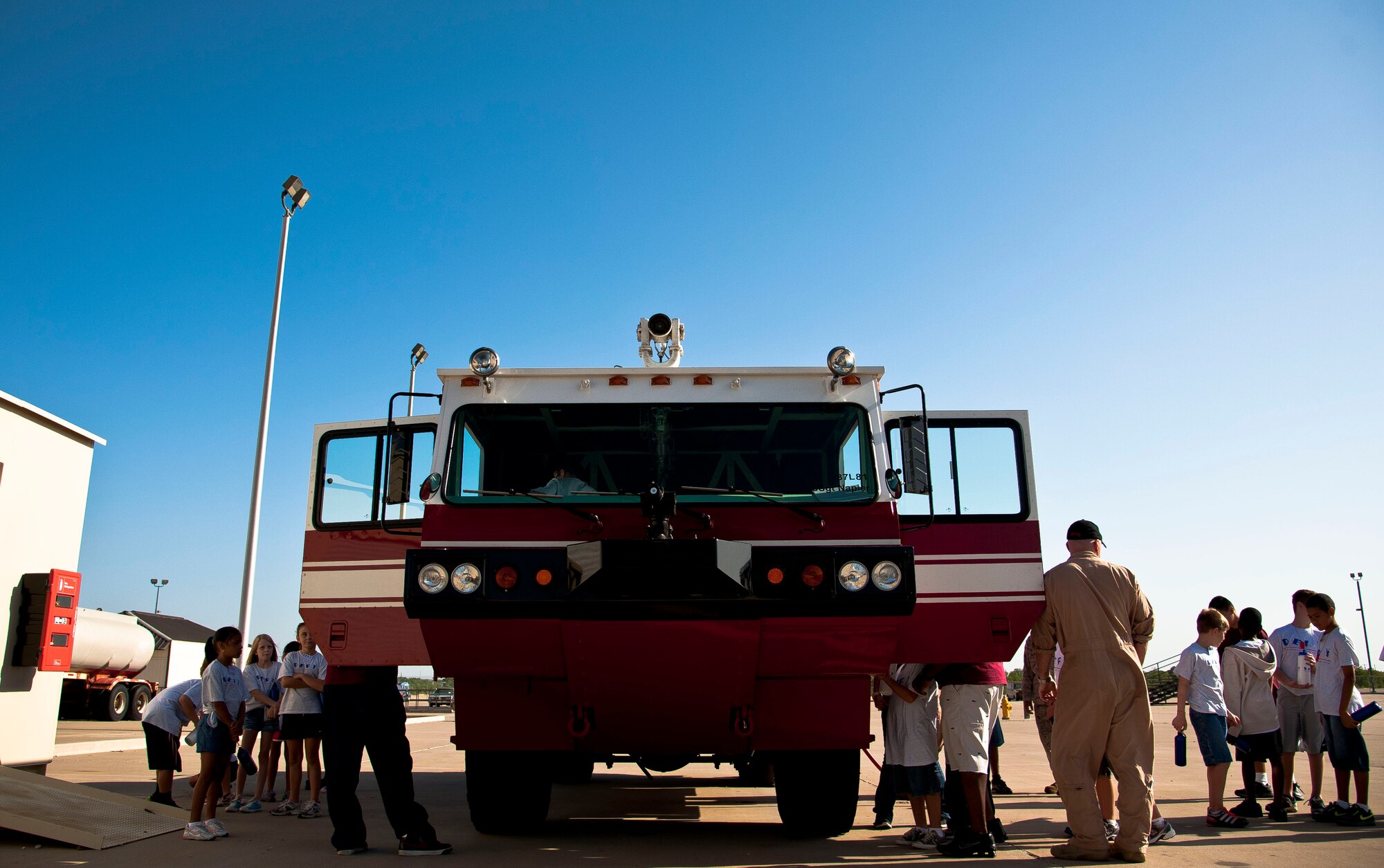 GOODFELLOW AIR FORCE BASE, Texas-- Children from the Drug Education for Youth Camp get a tour inside a fire truck at Louis F. Garland DOD Fire Academy July 17. The DEFY camp helps teach children the potential dangers of drugs and ways they can affect your life. (U.S. Air Force photo/Airman 1st Class Michael Smith) 