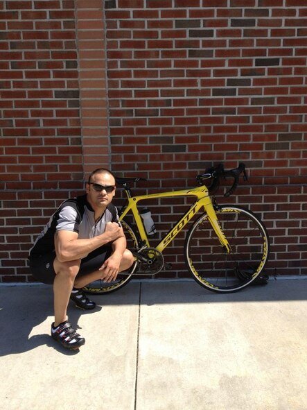Tech Sgt. David Perez, a U.S. Cyber Command directorate of logistics at Fort Meade, Md., poses beside the Scott Foil bike he rode in the Black Water duathlon in Cambridge, Md., on June 3, 2012.  Perez performed so well at the event, he was invited to represent the U.S. National Team at the 2012 Long Course Duathlon World Championships which will take place September 2, 2012, in Zofingen, Switzerland. (Courtesy photo)