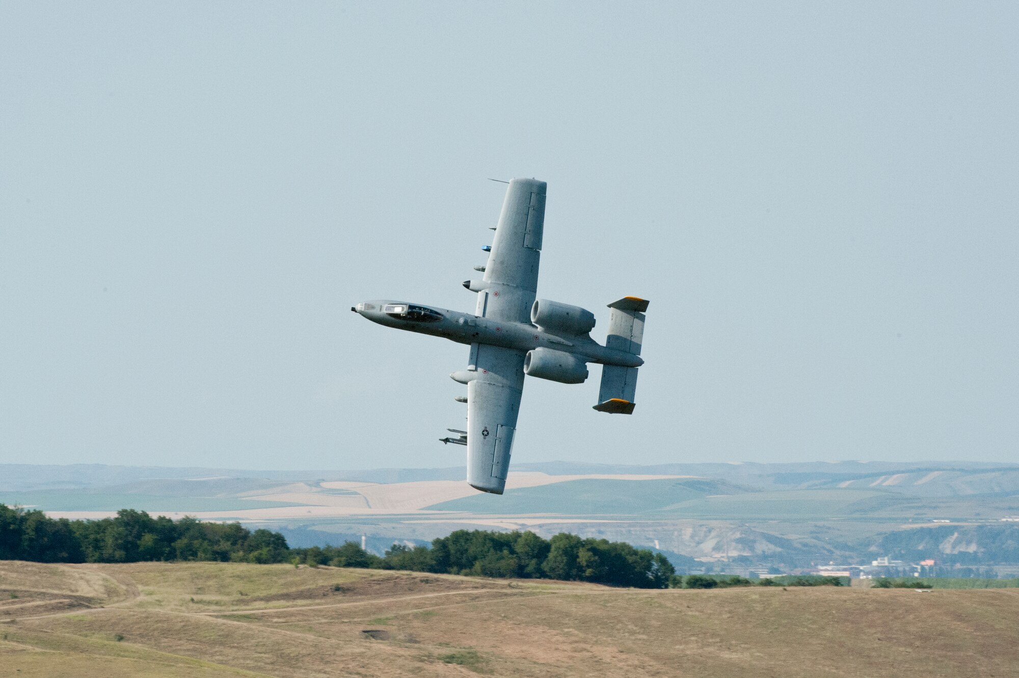 CAMPIA TURZII, Romania – An 81st Fighter Squadron A-10 Thunderbolt II pilot executes low-altitude strafes in a field here July 20 during Dacian Thunder, a partnership building exercise. Dacian Thunder is a month-long exercise in which U.S. Air Force, Romanian air force, U.S. Marine Corps and the Royal Air Force exchange techniques, tactics and procedures to strengthen coalition and joint capabilities. (U.S. Air force photo by Senior Airman Natasha Stannard/Released)