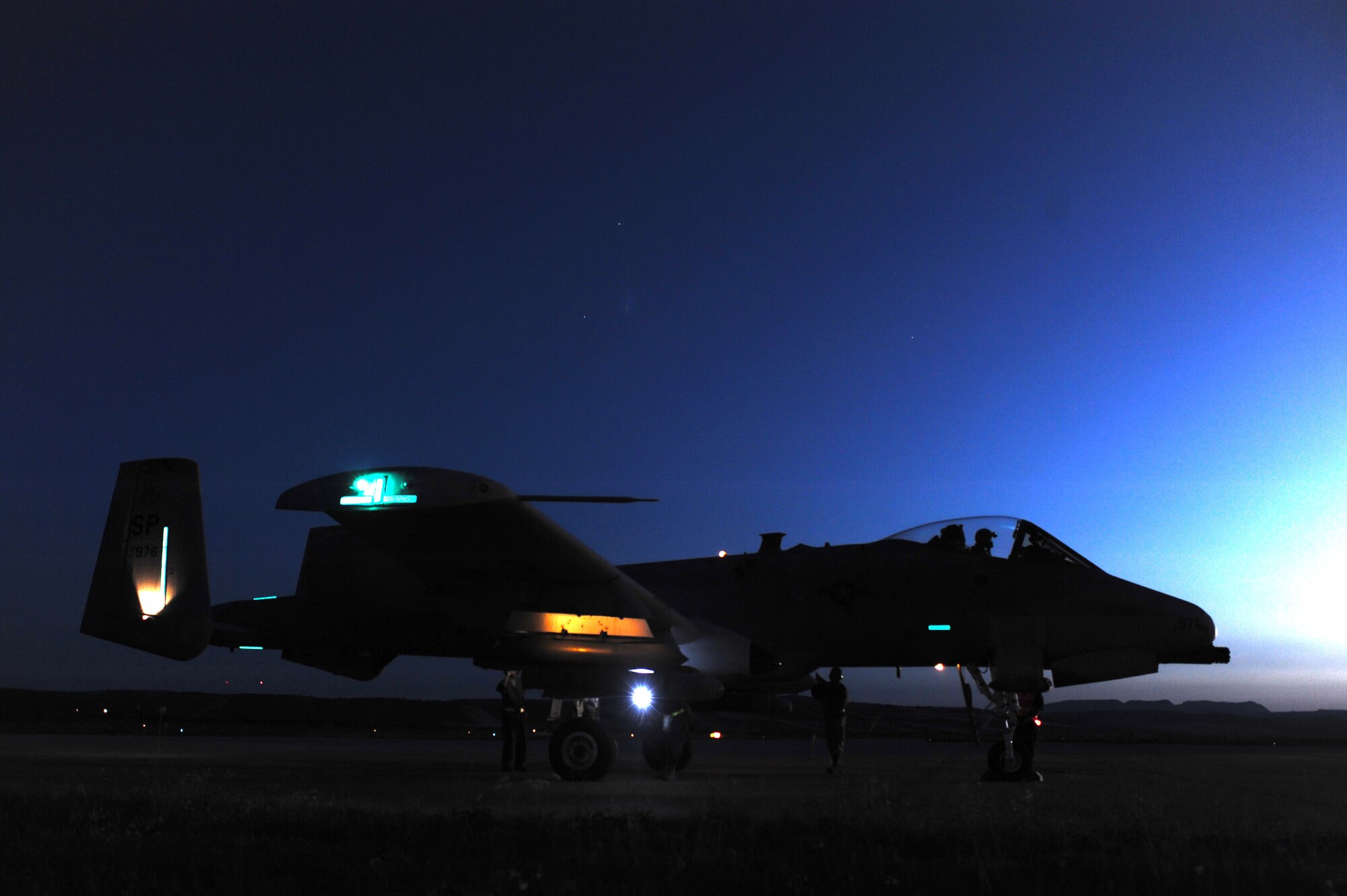 CAMPIA TURZII, Romania –  Maintainers from the 81st Fighter Squadron pull out firing pins and chalks to ready an A-10 Thunderbolt II for takeoff before a night combat search and rescue training mission July 20 during Dacian Thunder, a month-long partnership building exercise. Dacian Thunder is an exercise in which U.S. Air Force, Romanian air force, U.S. Marine Corps and the Royal Air Force exchange techniques, tactics, and procedures to strengthen coalition and joint capabilities. (U.S. Air force photo by Senior Airman Natasha Stannard/Released)
