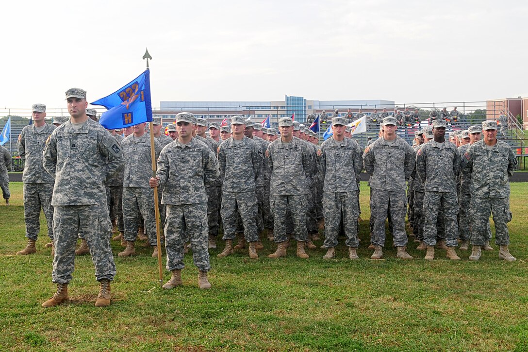 Members of the 1st Battalion, 222nd Aviation Regiment, H Company stand at parade rest before the change-of-command ceremony at Fort Eustis, Va., July 20, 2012. Traditionally, a change-of-command ceremony represents the formal transfer of authority from one unit’s commanding officer to another, ensuring the unit and its Soldiers are never without leadership.  (U.S. Air Force photo by Staff Sgt. Ashley Hawkins/Released)
