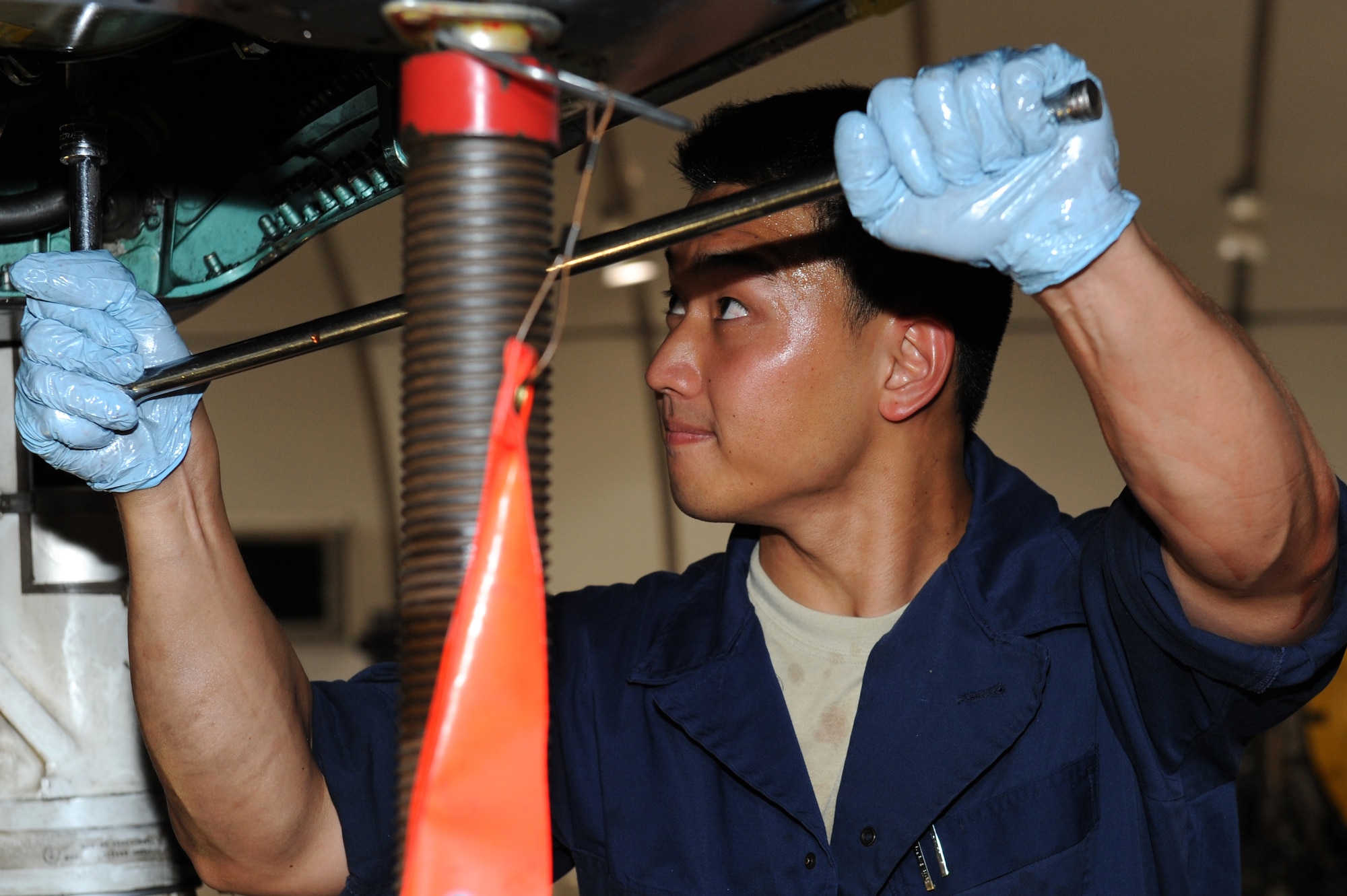 SOUTHWEST ASIA - U.S. Air Force  Senior Airman Joo Young Kim, 380th Expeditionary Maintenance Squadron phase inspection team member, turns a socket wrench on an F-15 Eagle July 20, 2012. Kim, a native of Guam, is deployed to the 380th Air Expeditionary Wing from Mountain Home Air Force Base, Idaho. (U.S. Air Force photo/Master Sgt. Scott MacKay)