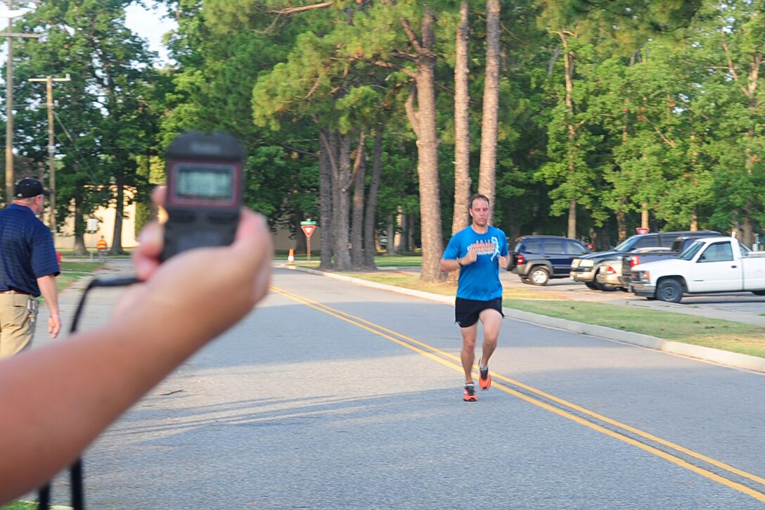 U.S. Army Staff Sgt. Kyle Daun, 221st Military Police, finishes third during the Army Ten-Miler time trial at Fort Eustis, Va., July 20, 2012. Fourteen Soldiers competed for a spot on a team of eight that will compete at the National Army Ten-Miler in October. (U.S. Air Force photo by Staff Sgt. Ashley Hawkins/Released)