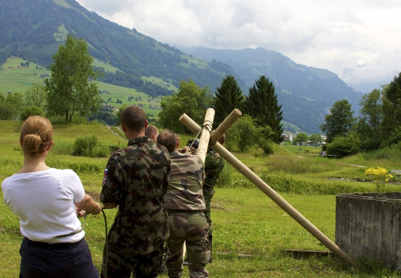 Students build an improvised aerial delivery device across a river to try and beat the clock in order to achieve the goal during an exercise at a "Smart Defense" class in Lucerne, Switzerland, July 5, 2012. Twenty-eight students from 15 allied and partner nations participated in the two-week class with extensive classroom work and field exercises, putting the theories and academics into action under stressful conditions while building and strengthening the multinational partnership. (U.S. Air Force photo/Master Sgt. Chris Almeria)