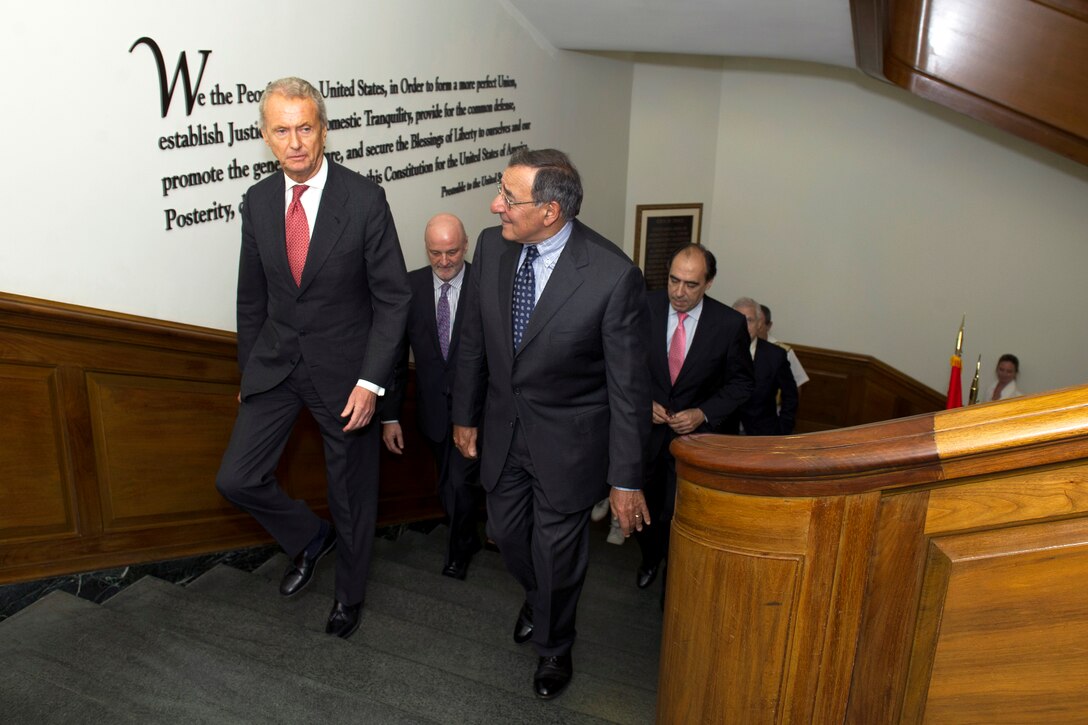 U.S. Defense Secretary Leon E. Panetta, right, escorts Spanish Defense Minister Pedro Morenes Eulate, left, to a meeting at the Pentagon, July 23, 2012.