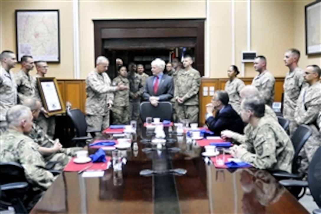 U.S. Ambassador to Afghanistan Ryan Crocker, center, expresses his appreciation after a ceremony making him an honorary Marine at the International Security Assistance Force Headquarters in Kabul, Afghanistan, July 22, 2012. U.S. Army Gen. John R. Allen, center left, commander of NATO and U.S. forces in Afghanistan, presided over the ceremony. Crocker is the 75th person to be named an honorary Marine. 