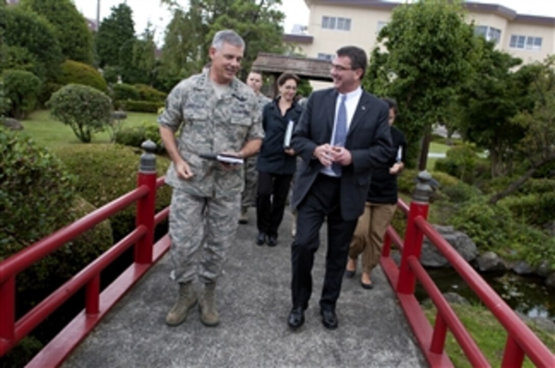 Deputy Secretary of Defense Ashton B. Carter walks with Air Force Lt. Gen. Sam Angelella, commander, U.S. Forces, Japan at Yokota Air Base, Japan, on July 21, 2012. Japan is the third stop for Carter in a 10-day Asia-Pacific trip with stops in Hawaii, Guam, Thailand, India and South Korea.  