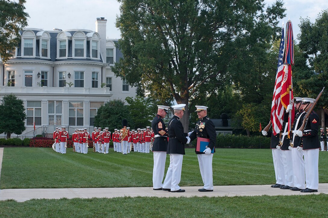 Lt. Gen. Dennis Hejlik, commanding general of Marine Forces Europe and U.S. Marine Corps Forces Command, recieves several awards and letters during his retirement ceremony at Marine Barracks Washington July 23.