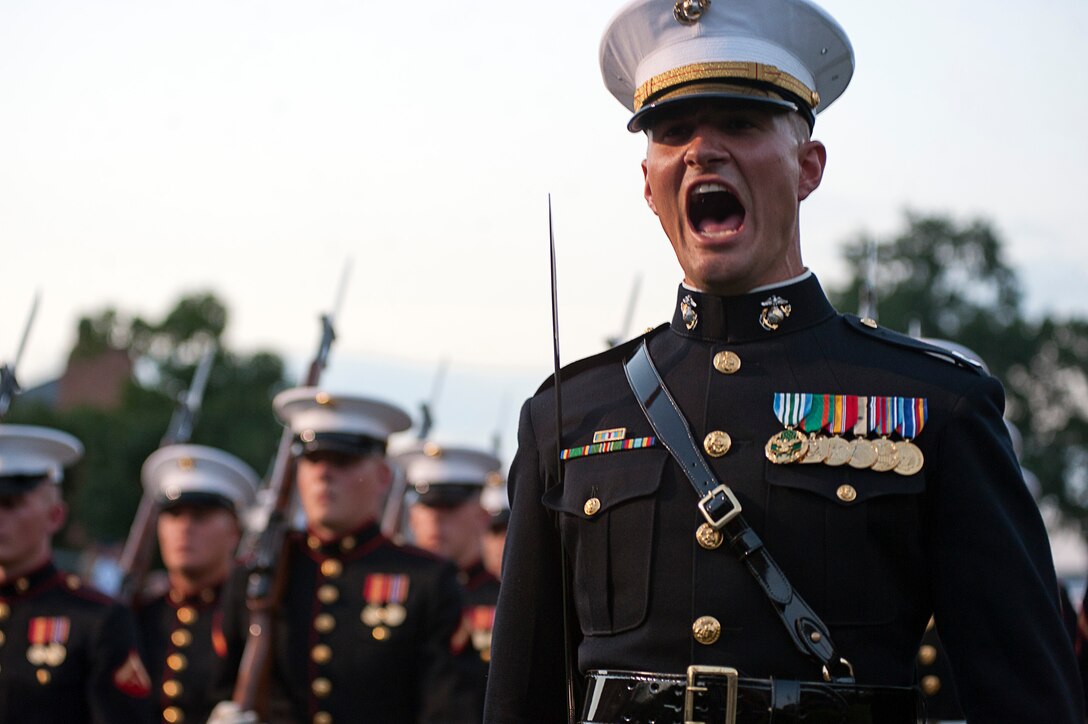Capt. Matthew Smith, Company B, 1st platoon commander, calls a command during a retirement ceremony at Marine Barracks Washington July 23.