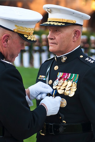 Gen. James F. Amos, commandant of the Marine Corps, awards the Distinguished Service Medal to Lt. Gen. Dennis Hejlik, commanding general of Marine Forces Europe and Marine Corps Forces Command, for 44 years of service to Corps and country during Hejlik's retirement ceremony at Marine Barracks Washington July 23.