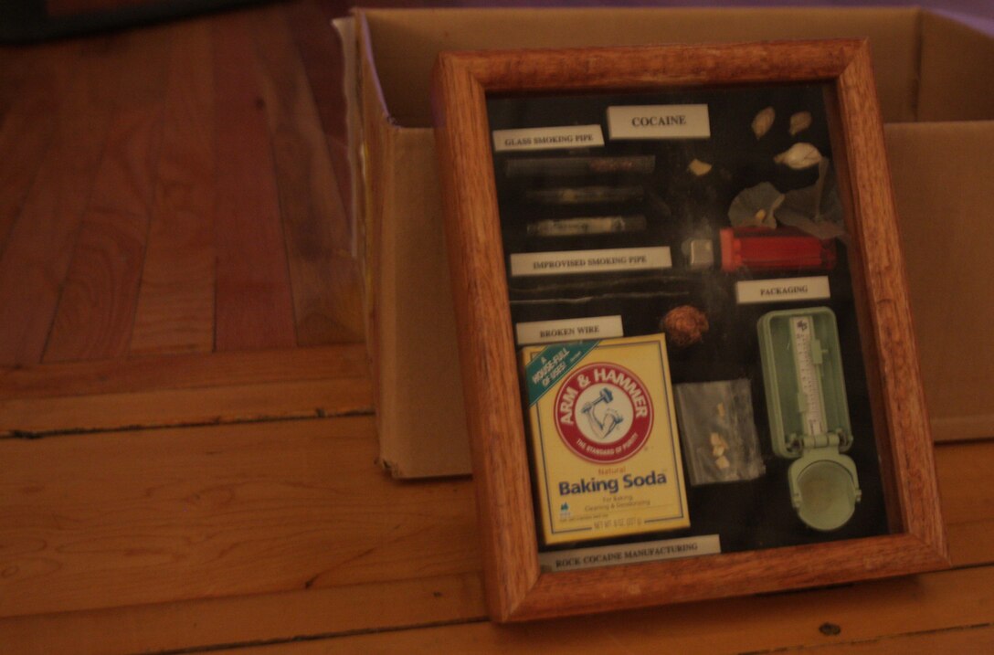 In addition to briefs on symptoms and side effects of illegal drug use detectives displayed examples of drug paraphernalia during a drug awareness brief at the Bob Hope Theater aboard Marine Corps Air Station Miramar, Calif., July 23. Marines learned what to look for if they suspect a fellow Marine is using illegal drugs.