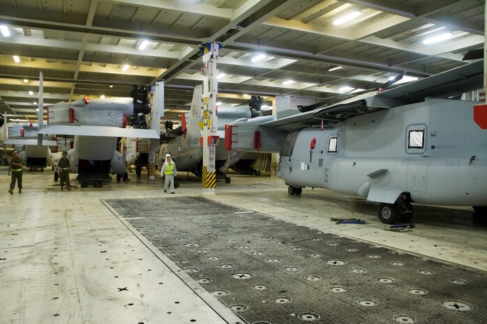 MV-22 Osprey aircraft with Marine Medium Helicopter Squadron 265 sit within the hull of the cargo ship Green Ridge as they wait to be unloaded at the Marine Corps Air Station Iwakuni harbor here July 23, 2012. This marks the first MV-22 Osprey aircraft deployment to Japan and a milestone in the Marine Corps' process of replacing CH-46E helicopters with the MV-22 Osprey, a highly-capable, tilt-rotor aircraft which combines the vertical capability of a helicopter with the speed and range of a fixed-wing aircraft.