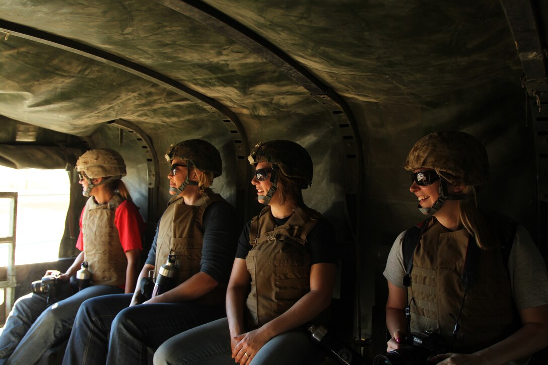Family members of 2nd Battalion, 7th Marine Regiment, Marines load into 7-ton vehicles during the 2/7 Jayne Wayne Day event June 29.