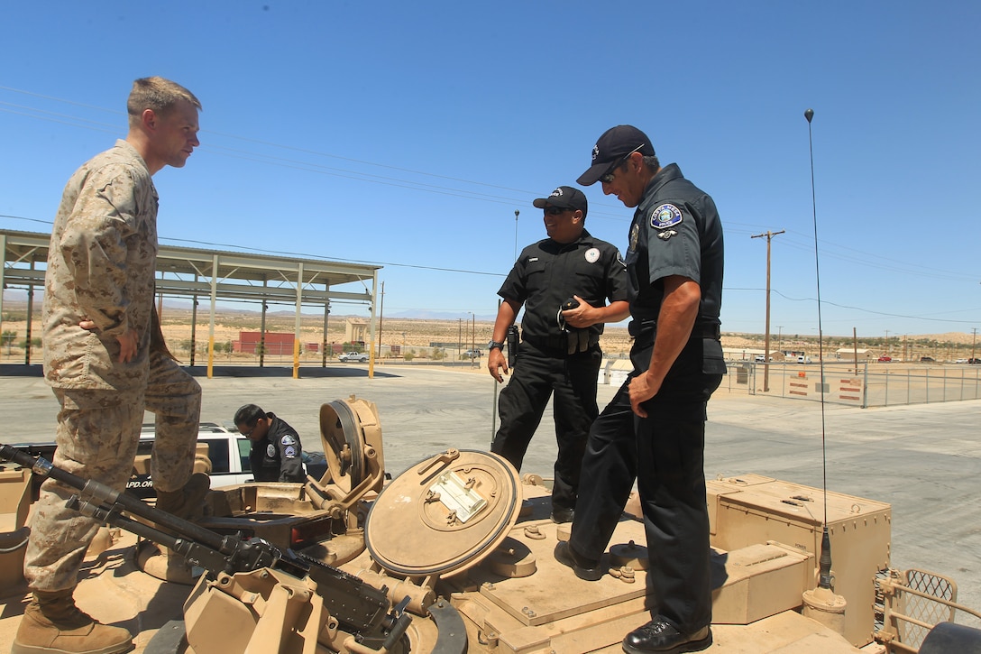 Costa Mesa Police Officers visit Marines of 1st Tank Battalion and get an inside look at the M1A1 Abrams Tank at the battalion's tank ramp June 28, 2012. The Marines also got an up close look at the officers' motorcycles. 