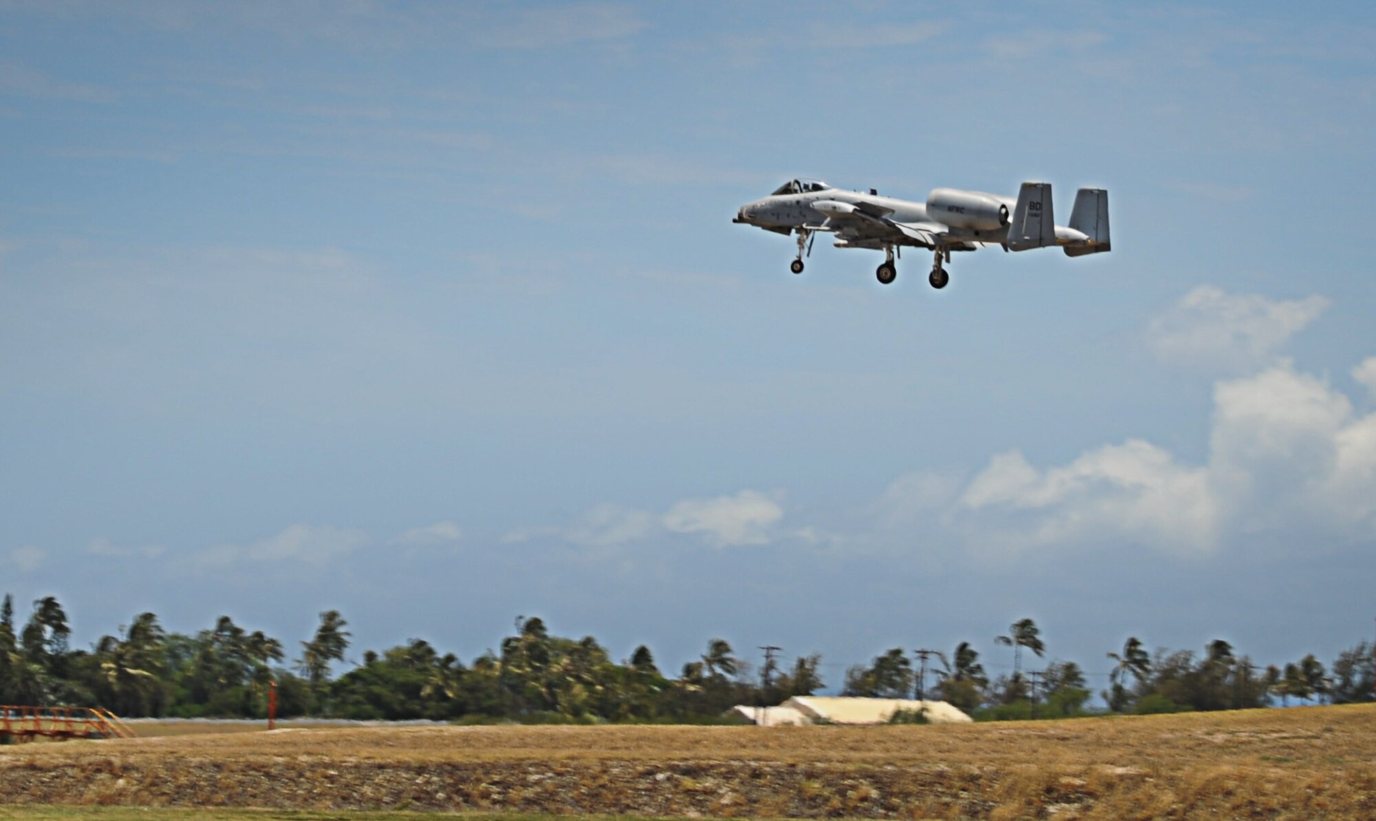 An A-10 Thunderbolt II  from the 47th Fighter Squadron, Barksdale Air Force Base, LA, descends from the skies to land on the15th Wing flightline at Joint Base Pearl Harbor-Hickam, HI during the Rim of the Pacific Exercise, July 23. RIMPAC is the world's largest maritime exercise with more than 20 countries participating. (U.S. Air Force photo by Senior Airman Lauren Main) 