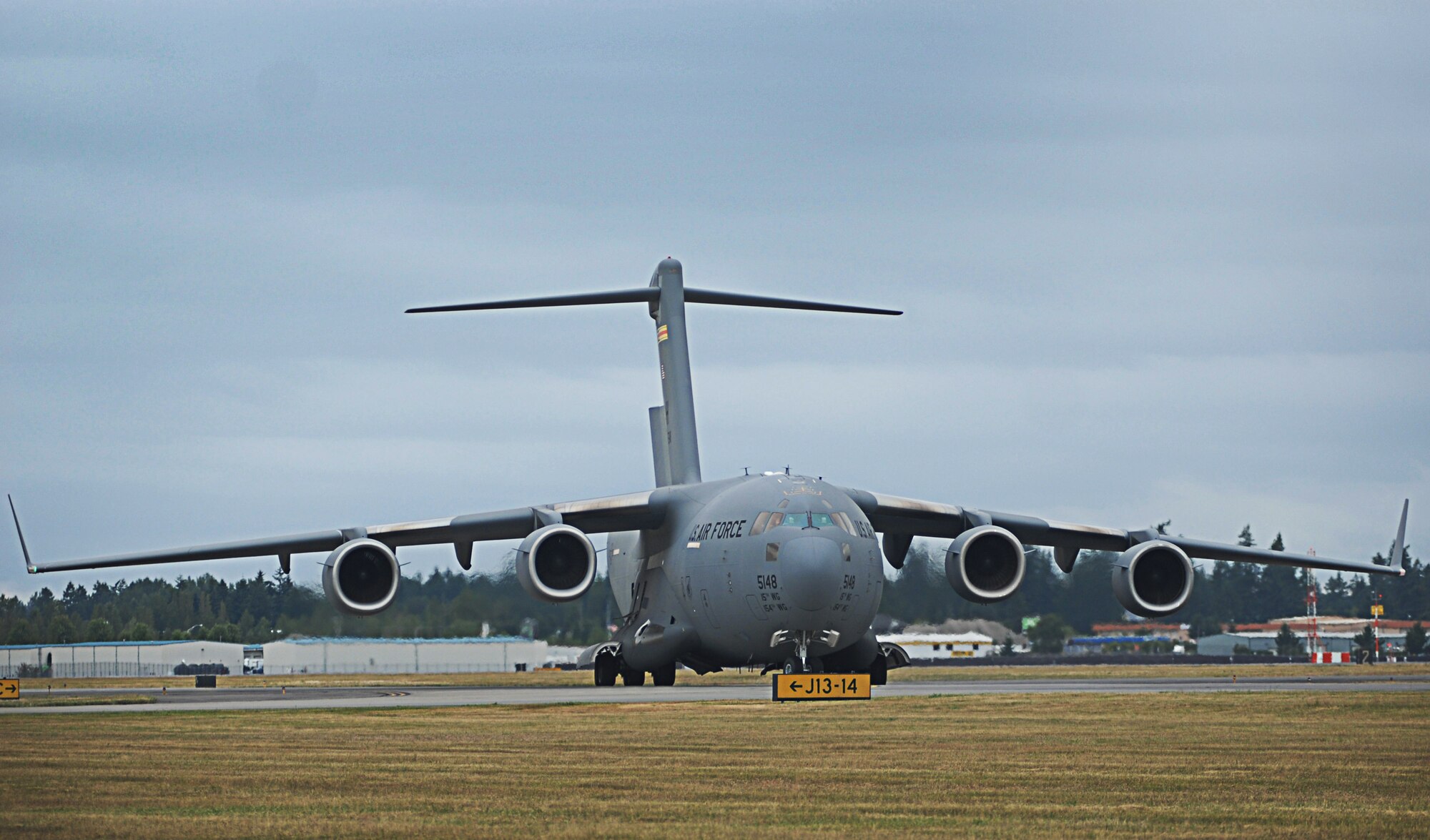 A C-17 Globemaster III from the 535th Airlift Squadron at Joint Base Pearl Harbor-Hickam, Hawaii, taxis during the Pacific Air Forces C-17 Aerial Demonstration Team at the Joint Base Lewis-McChord Air Expo 2012 at McChord Field, Washington July 22. The JBLM Air Expo 2012 featured 20 aerial performers and over 40 static aircraft displays. (U.S. Air Force photo by 2nd Lt. Jessica Colby)