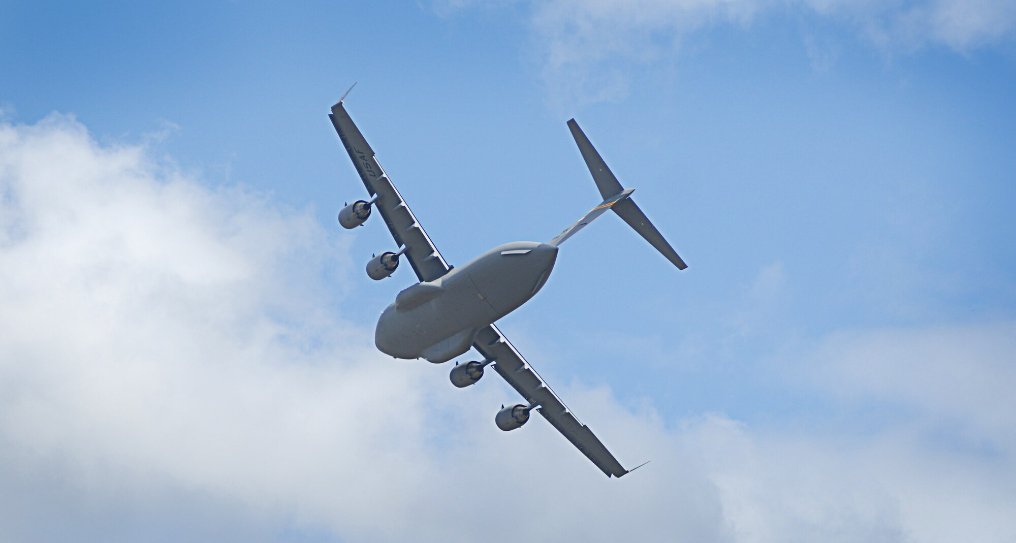 A C-17 Globemaster III from the 535th Airlift Squadron at Joint Base Pearl Harbor-Hickam, Hawaii, performs as part of the Pacific Air Forces C-17 Aerial Demonstration Team at the Joint Base Lewis-McChord Air Expo 2012 at McChord Field, Washington July 21. The JBLM Air Expo 2012 featured 20 aerial performers and over 40 static aircraft displays. (U.S. Air Force photo by 2nd Lt. Jessica Colby)