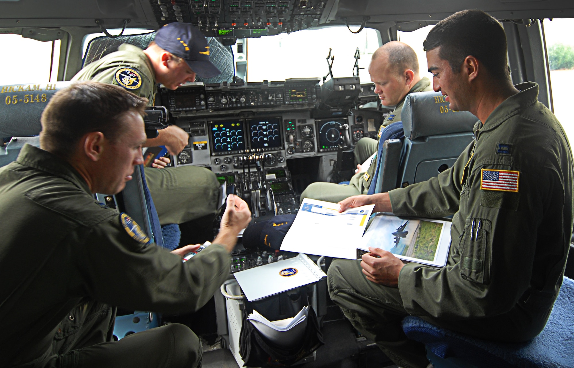 Members of the Pacific Air Forces C-17 Aerial Demonstration Team make final pre-flight preparations prior to performing at the Joint Base Lewis-McChord Air Expo 2012 at McChord Field, Washington July 21. The JBLM Air Expo 2012 featured 20 aerial performers and over 40 static aircraft displays. (U.S. Air Force photo by 2nd Lt. Jessica Colby)