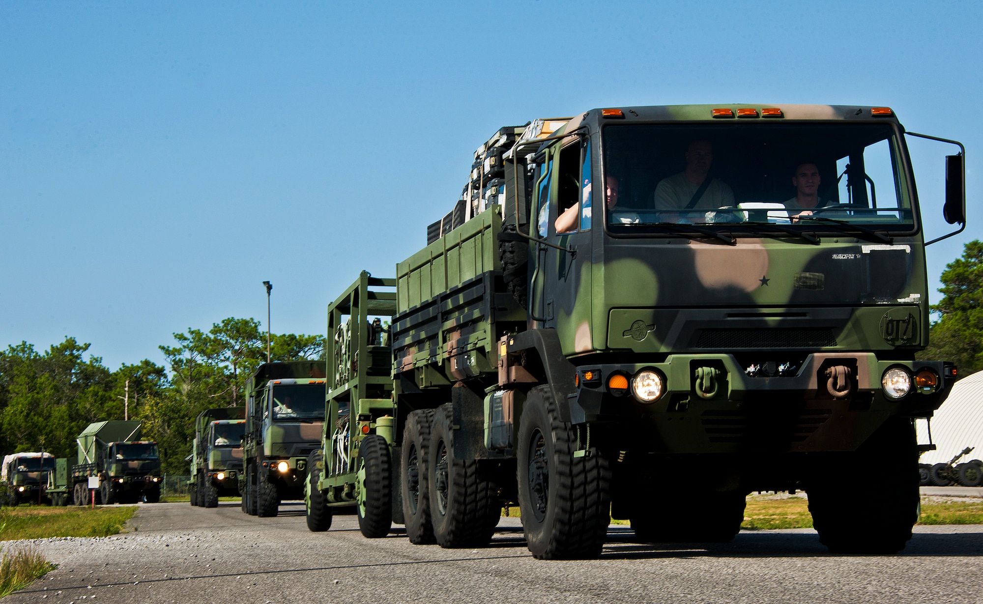 A convoy of 728th Air Control Squadron Airmen, vehicles and equipment roll out beginning the squadron’s deployment readiness exercise called Bison Fury July 24 at Eglin Air Force Base, Fla.  This exercise marks the last large-scale exercise for the squadron, which is scheduled to be deactivated in 2013.  (U.S. Air Force photo/Samuel King Jr.)