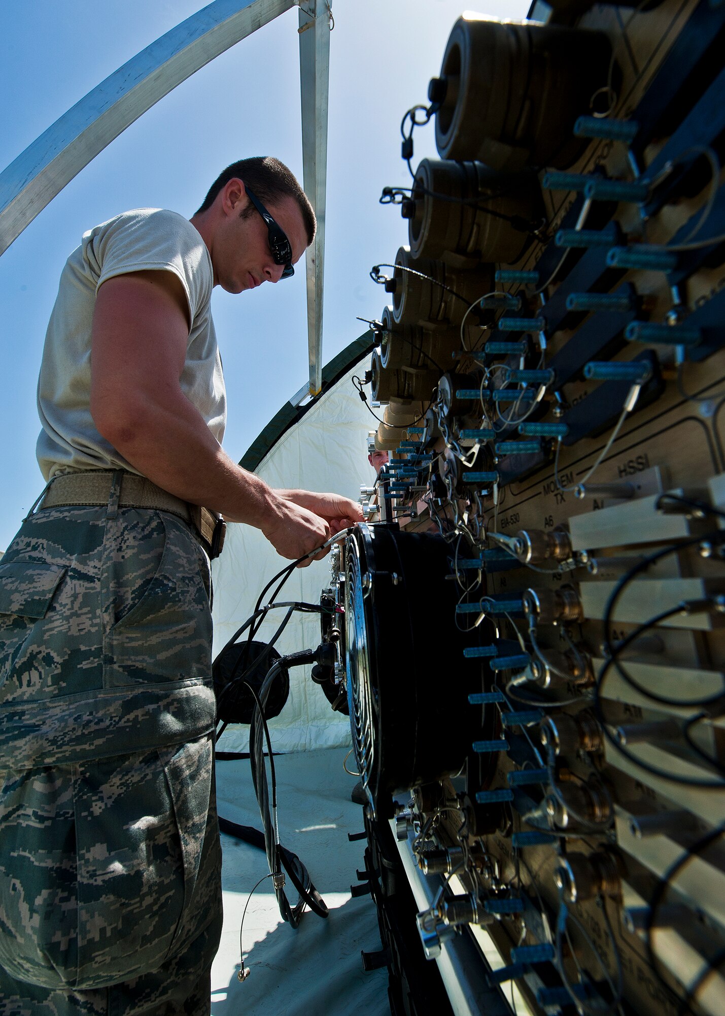 Senior Airman Byron Bevis, a radio frequency transmission systems technician, connects antenna control cables to a Ground Multi-Band Terminal control box during initial setup of a deployed radar site during a 728th Air Control Squadron deployment readiness exercise called Bison Fury July 24 at Eglin Air Force Base, Fla.  This exercise marks the last large-scale exercise for the squadron, which is scheduled to be deactivated in 2013.  (U.S. Air Force photo/Samuel King Jr.)

 This exercise marks the last large-scale exercise for the squadron, which is scheduled to be deactivated in 2013.  (U.S. Air Force photo/Samuel King Jr.)