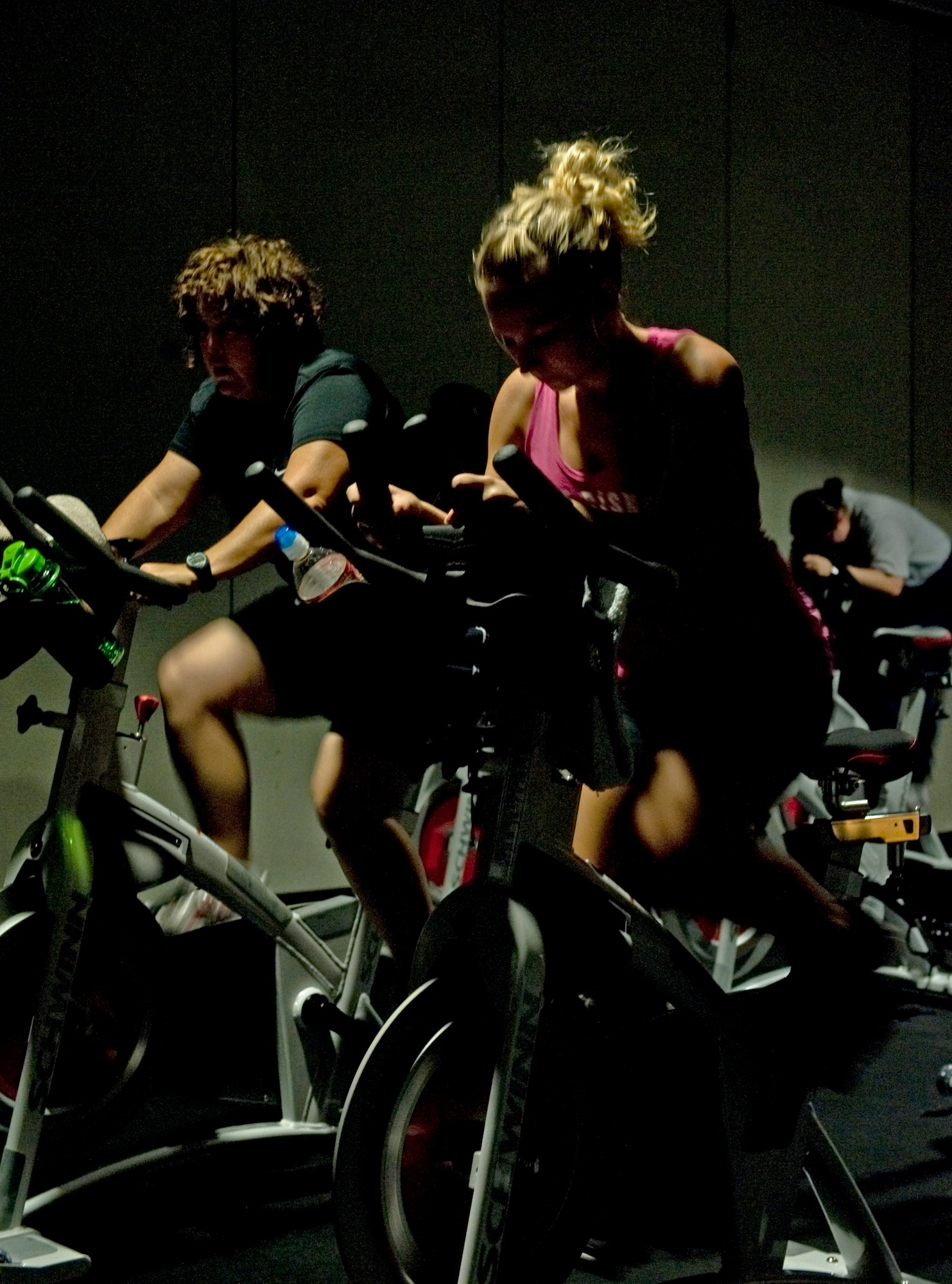 Members of a run program let their muscles recover by participating in a low-impact spin class July 19, 2012, at Dyess Air Force Base, Texas. The run program, designed by the Health and Wellness Center, improves Airmen’s cardiovascular strength and endurance, informs them on running essentials and trains them to be able to run for much longer distances at a faster pace than when they started. (U.S. Air Force photo by Airman 1st Class Peter Thompson/ Released)