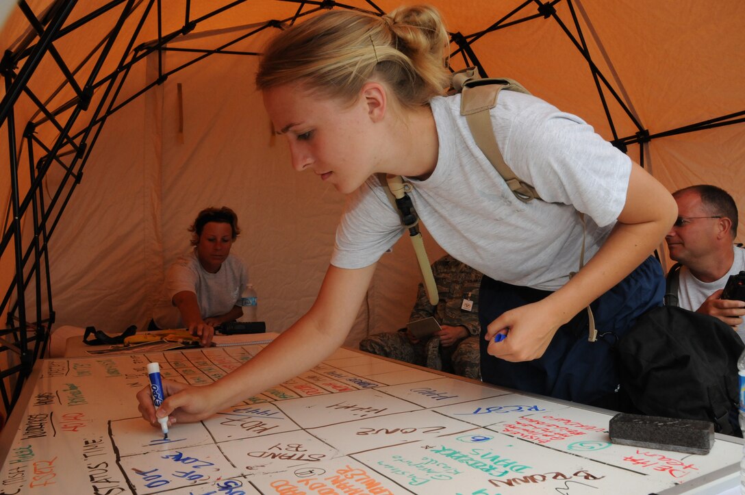 Senior Airman Kayla Goorhouse, 148th Fighter Wing, Minnesota Air National Guard helps run the Tatical Operation Center July 19, 2012 in support of PATRIOT 2012.  PATRIOT 2012 is an annual National Guard emergency reponse exercise and is comprised of more than 1,100 military and civilian personnel.  (National Guard photo by Master Sgt. Ralph J. Kapustka/Released)