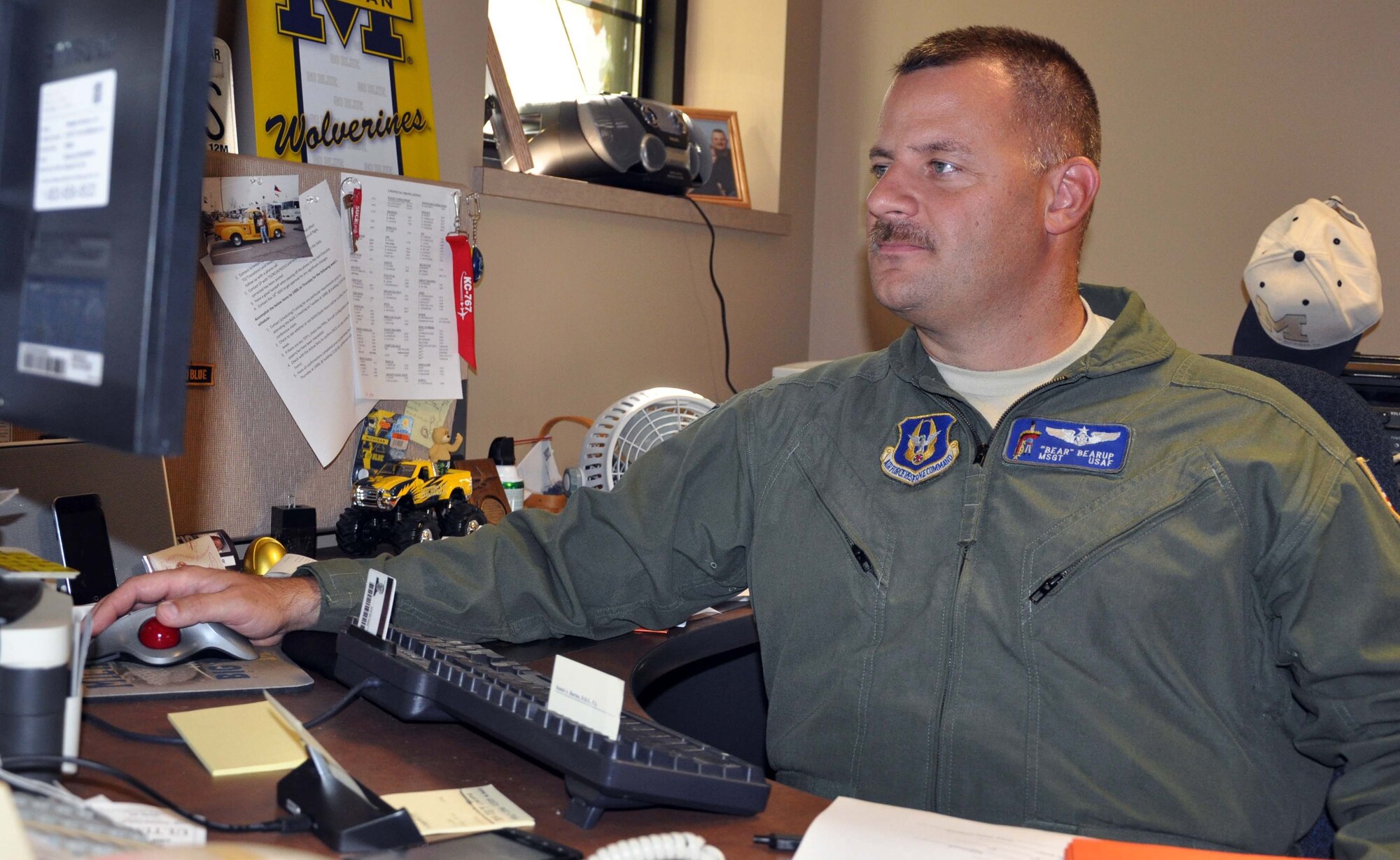 Master Sgt. Warren "Bear" Bearup, a refueling boom operator and long-range scheduler assigned to the 931st Air Refueling Group, McConnell Air Force Base, Kan., works on building an air refueling mission in the 931st scheduling office, July 20, 2012.  Bearup and other schedulers work to build flying missions, coordinate with other units for the air refueling of receiver aircraft, and ensure the timing of missions works out right.  (U.S. Air Force photo by 1st Lt. Zach Anderson)