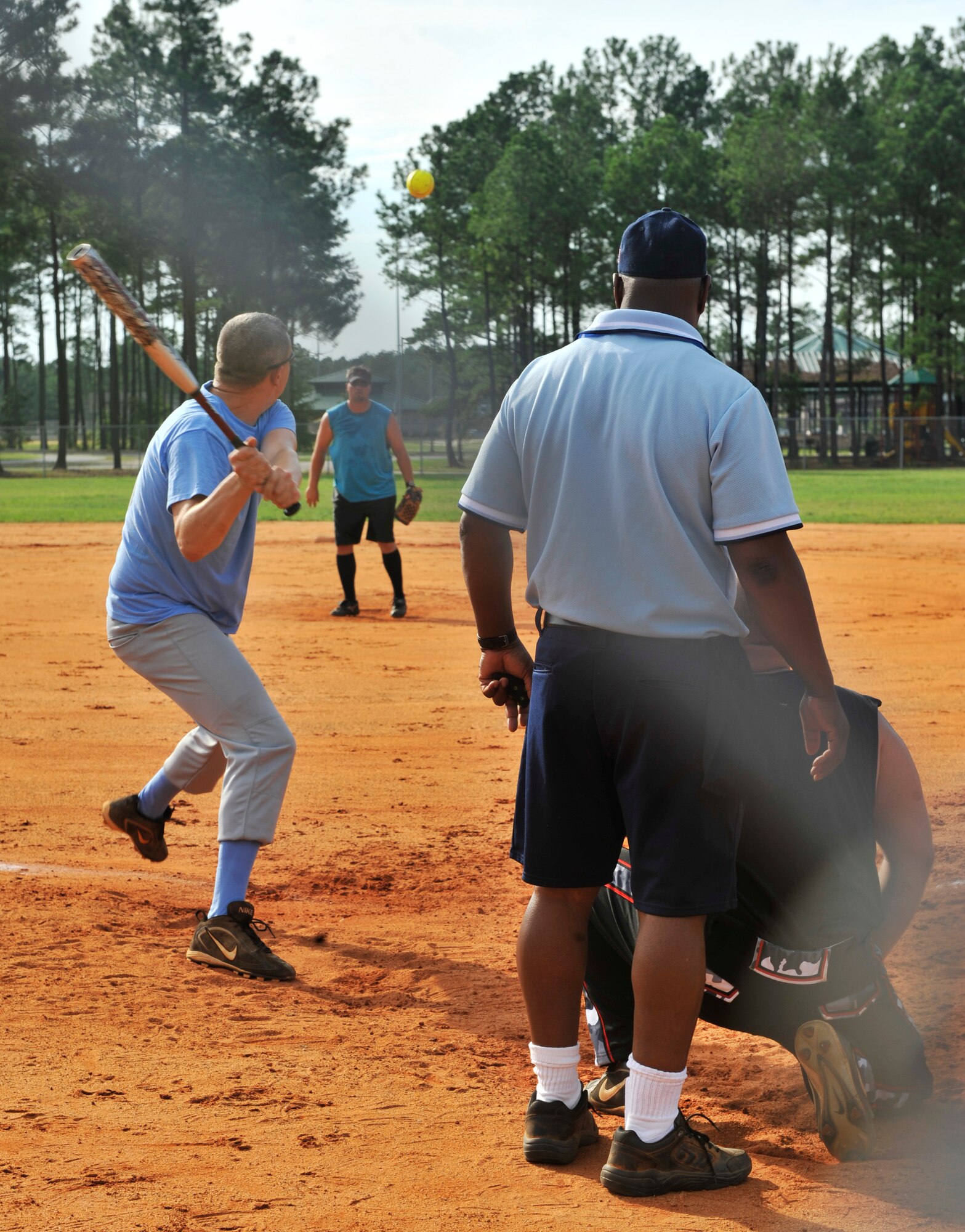 U.S. Air Force Staff Sgt. Brian Joki, 20th Civil Engineer Squadron water and fuels system maintenance, prepares to hit a ball during a softball game at Shaw Air Force Base, S.C., July 17, 2012. Every year Shaw holds softball intramural games which many teams play against each other to get to the playoffs. (U.S. Air Force photo by Senior Airman Tabatha McCarthy/ released)
