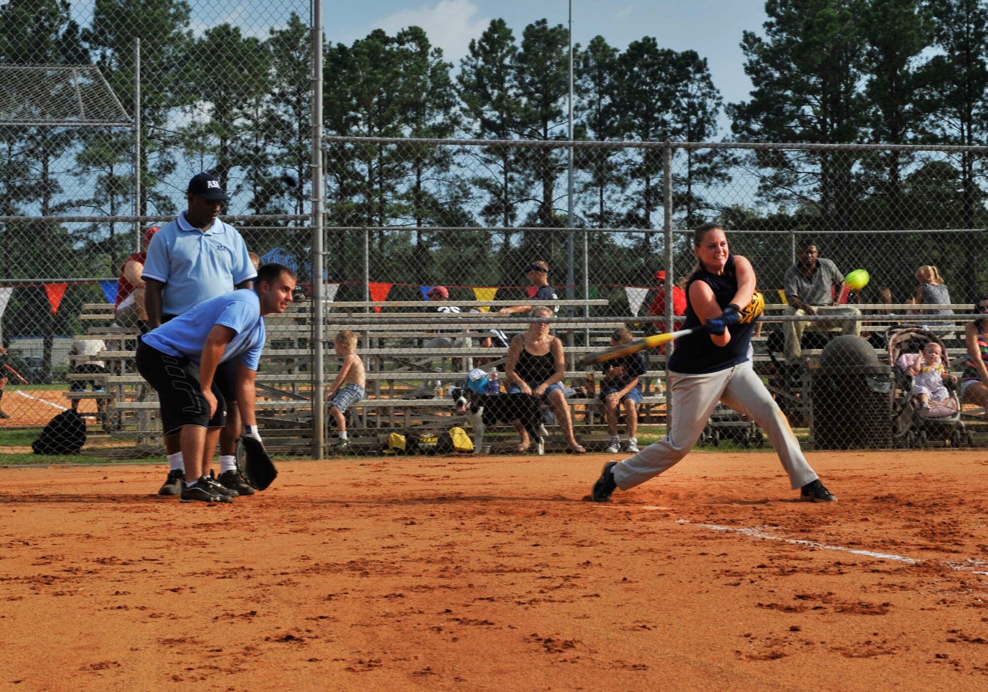 U.S. Air Force Senior Airman Anna Reece, 20th Force Support Squadron alternate intramural sports director, hits the ball during a softball game at Shaw Air Force Base, S.C., July 17, 2012. With about 30 games left before the playoffs, the 20th Civil Engineer Squadron won 13 to 8 against the 20th Maintenance Operations Squadron. (U.S. Air Force photo by Senior Airman Tabatha McCarthy/ Released)
