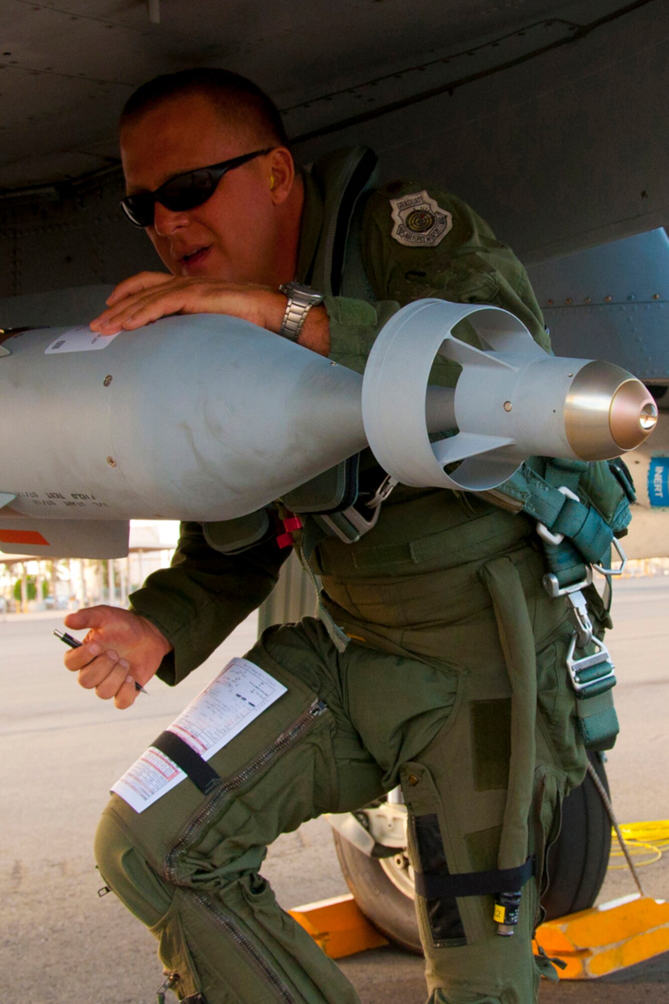 JOINT BASE PEARL HARBOR-HICKAM, Hawaii - U.S. Air Force Maj. Maury Kent, 47th Fighter Squadron pilot, conducts pre-flight checks of an A-10 Thunderbolt II during the Rim of the Pacific military exercise July 17, 2012, at Joint Base Pearl Harbor-Hickam, Hawaii.  Twenty-two nations, more than 40 ships and submarines, more than 200 aircraft and 25,000 personnel are participating in RIMPAC from June 29 to Aug. 3, in and around the Hawaiian Islands. The world's largest international maritime exercise, RIMPAC provides a unique training opportunity that helps participants foster and sustain the cooperative relationships that are critical to ensuring the safety of sea lanes and security on the world's oceans. RIMPAC 2012 is the 23rd exercise in the series that began in 1971. (U.S. Air Force photo by Staff Sgt. Ted Daigle/Not Released)