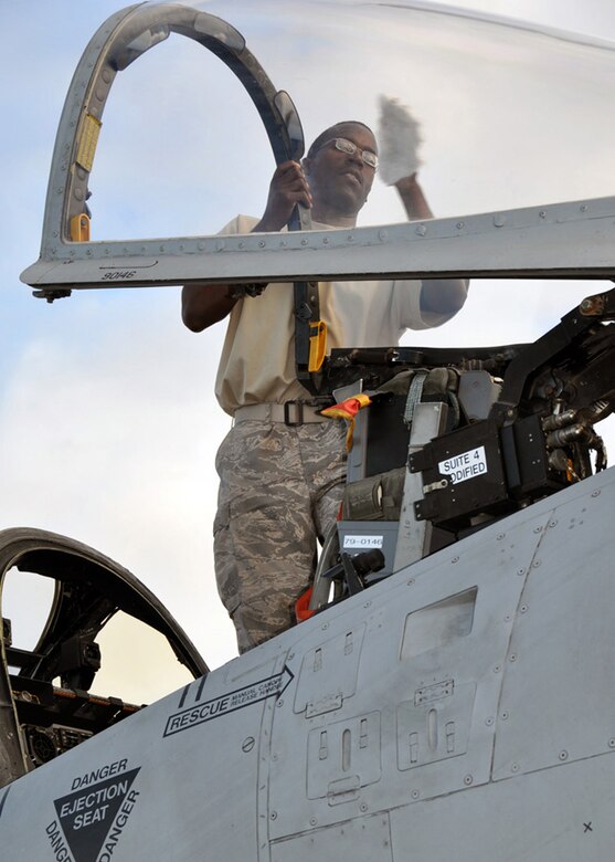 JOINT BASE PEARL HARBOR-HICKAM, Hawaii - U.S. Air Force Tech. Sgt. Keith Rowlan, a crew chief with the 476th Maintenance Squadron at Moody Air Force Base, Ga., cleans the windows of the A-10 Thunderbolt II prior to a flight during the Rim of the Pacific exercise July 17, 2012. Twenty-two nations, more than 40 ships and submarines, more than 200 aircraft and 25,000 personnel are participating in RIMPAC from June 29 to Aug. 3, in and around the Hawaiian Islands. The world's largest international maritime exercise, RIMPAC provides a unique training opportunity that helps participants foster and sustain the cooperative relationships that are critical to ensuring the safety of sea lanes and security on the world's oceans. RIMPAC 2012 is the 23rd exercise in the series that began in 1971. (U.S. Air Force photo by Master Sgt. Mary Hinson/NOT RELEASED)