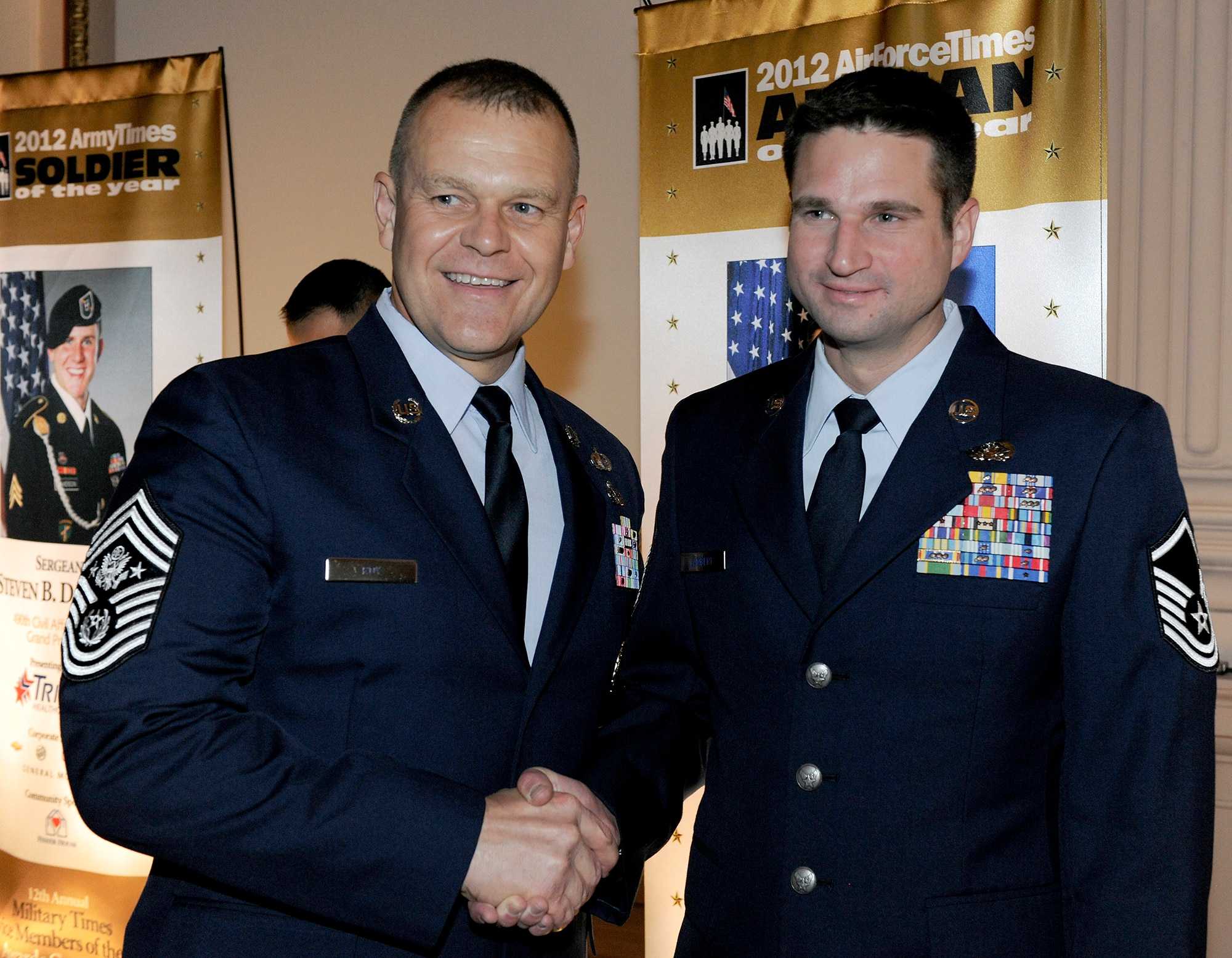 Chief Master Sergeant of the Air Force James A. Roy congratulates Master Sgt. Brandon Lambert of the 728th Air Control Squadron, Eglin Air Force Base, Fla., on his selection as the 2012 Air Force Times Airman of the Year during the 2012 Military Times’ Service Members of the Year Awards awards ceremony July 19, 2012, in Washington, D.C.  (U.S. Air Force photo/Scott M. Ash)